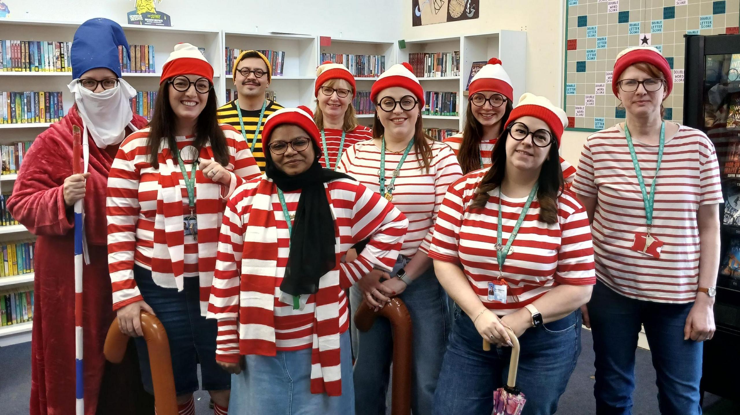 A group of staff members at Sir Bernard Lovell Academy in Oldland Common line up for the camera on World Book Day. They are all dressed as the character Wally from the "Where's Wally" books, wearing red stripey shirts and hats