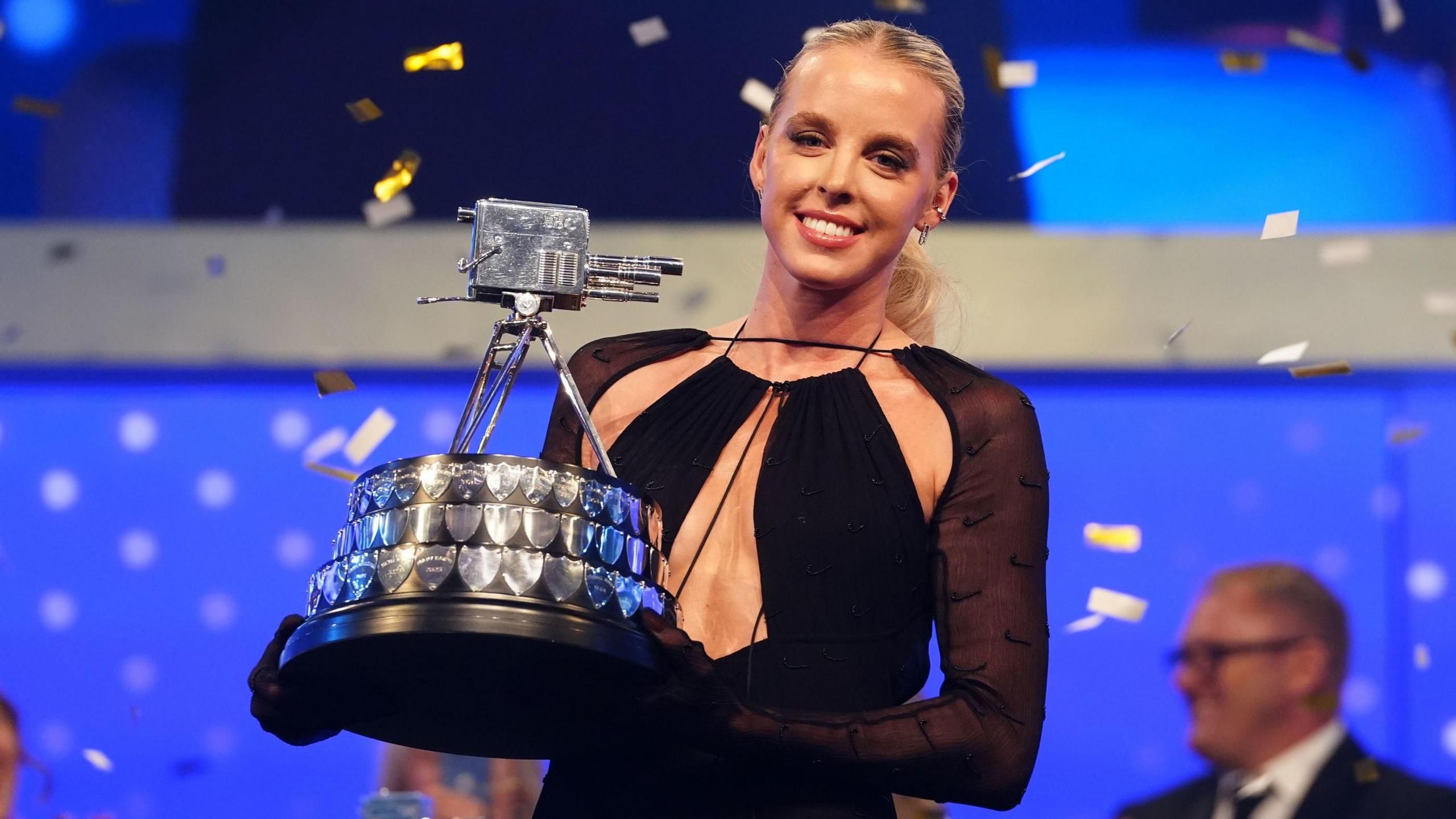 Keely Hodgkinson holding the BBC Sports Personality of the Year award