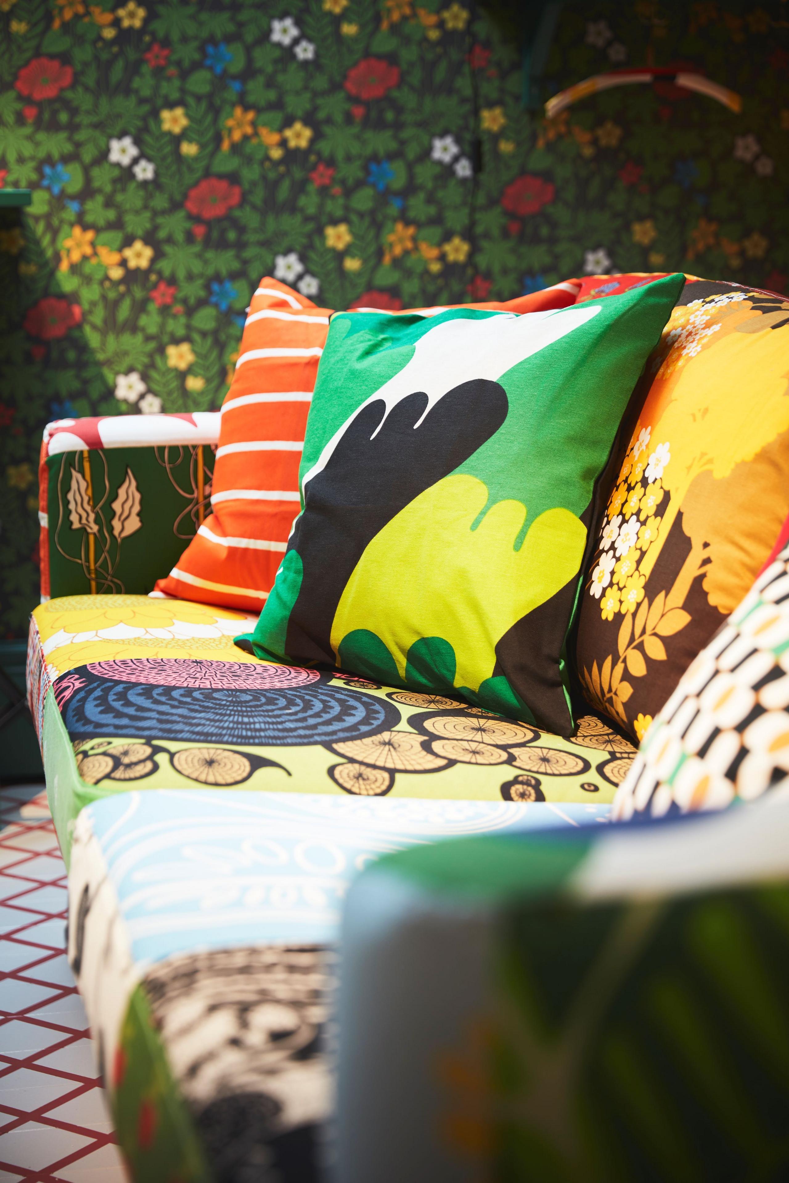 A close-up of a colourful sofa in a room full of patterns.