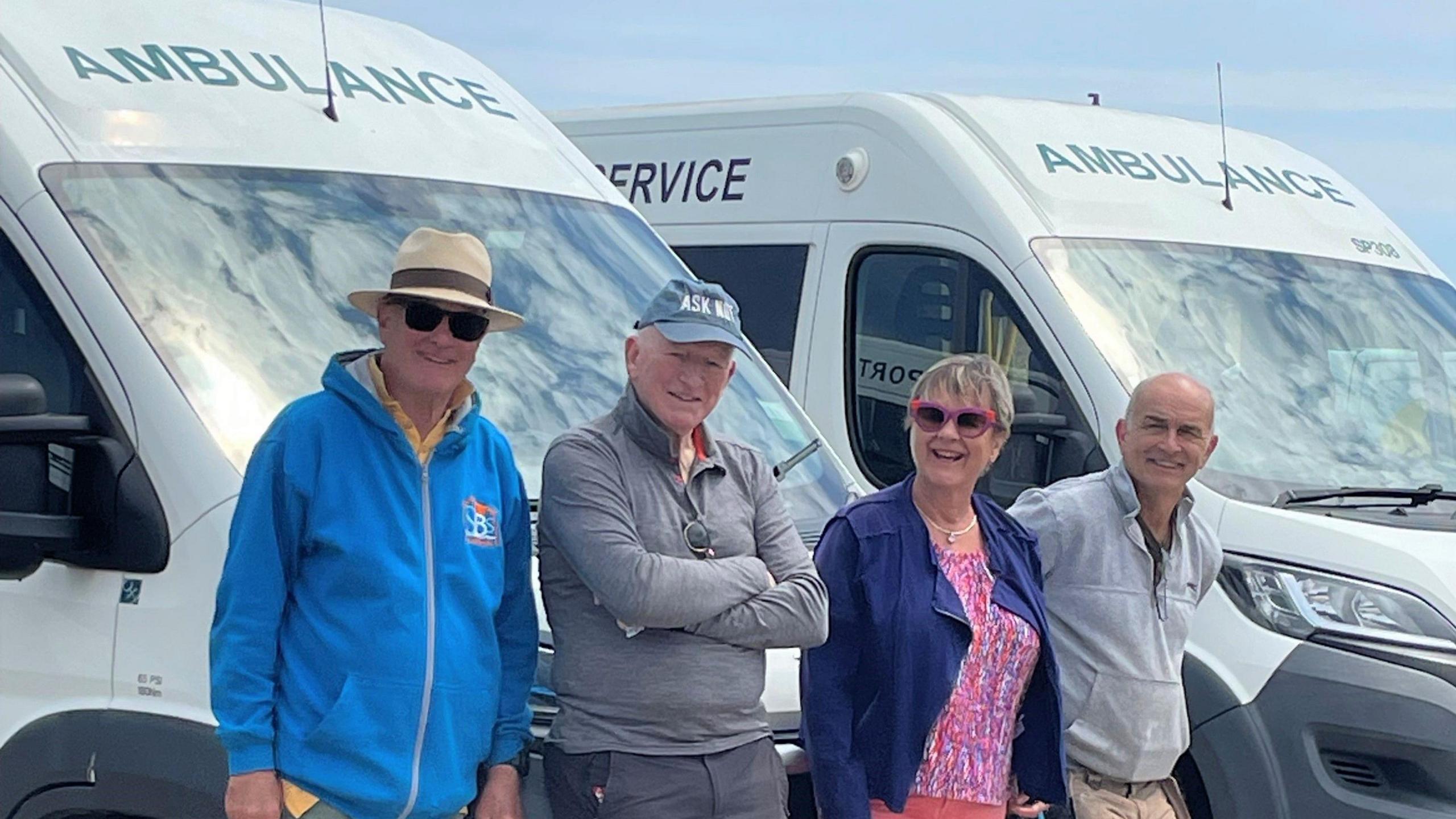 Southwold's John Nickell-Lean and Janee Miller (middle) with friends and ambulances