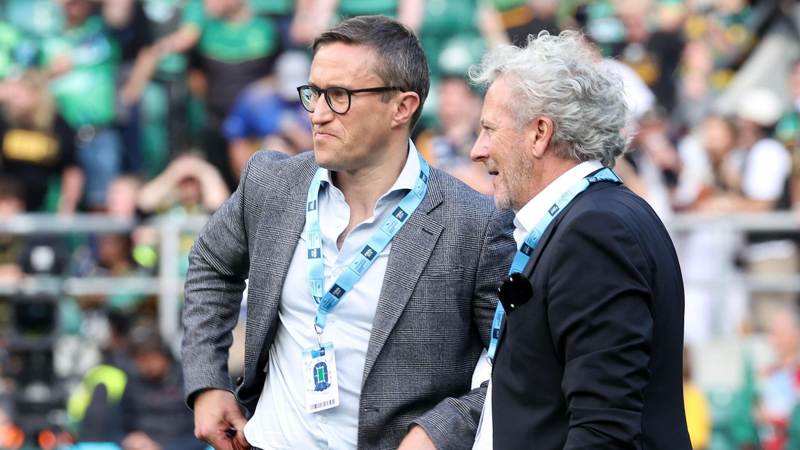 Bath CEO Tarquin McDonald and owner Bruce Craig (right) standing on the pitch talking