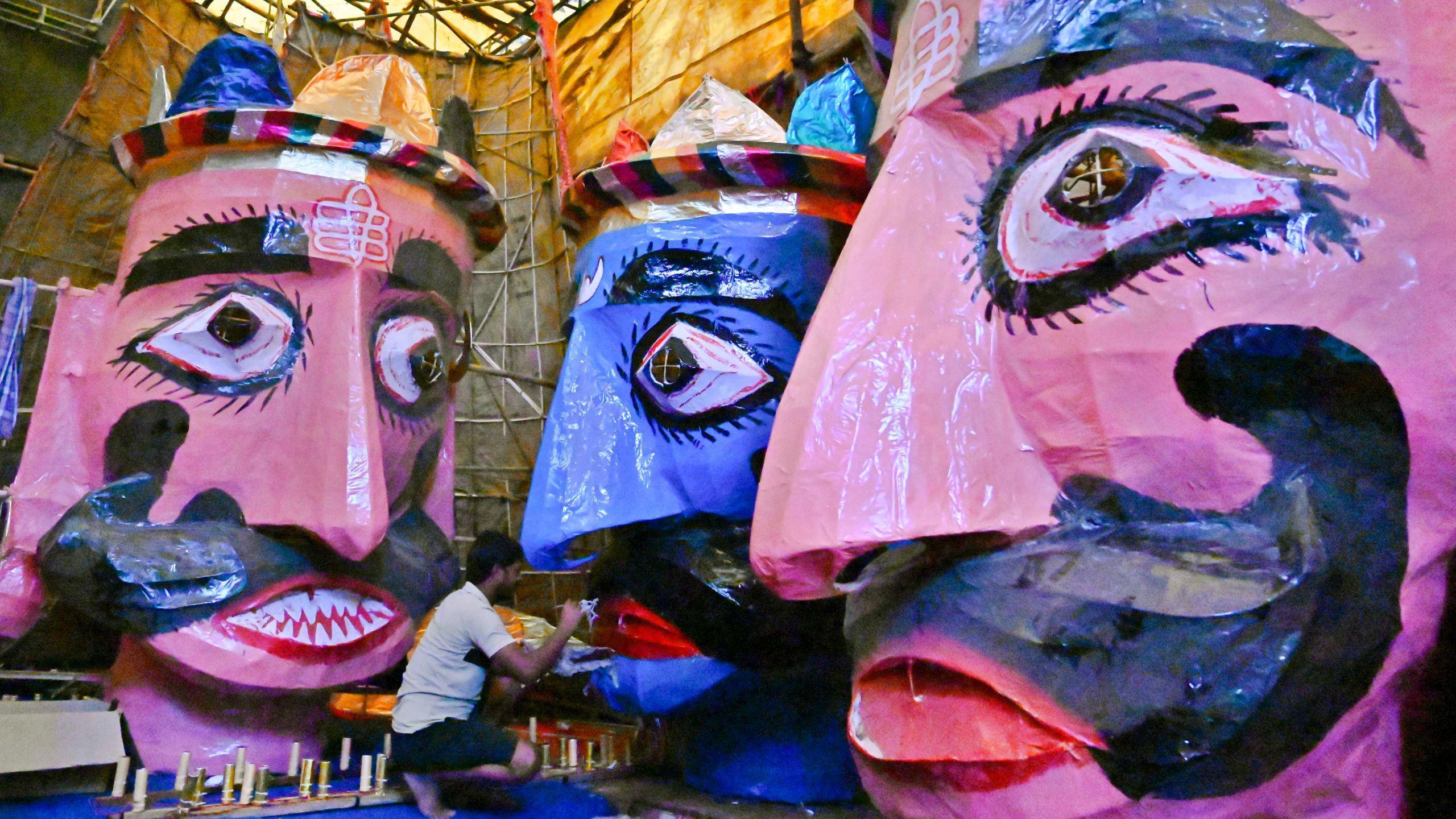Artists prepare three massive effigies of the Hindu demon king Ravana, ahead of the upcoming Dussehra festival at Red Fort in New Delhi, India. 