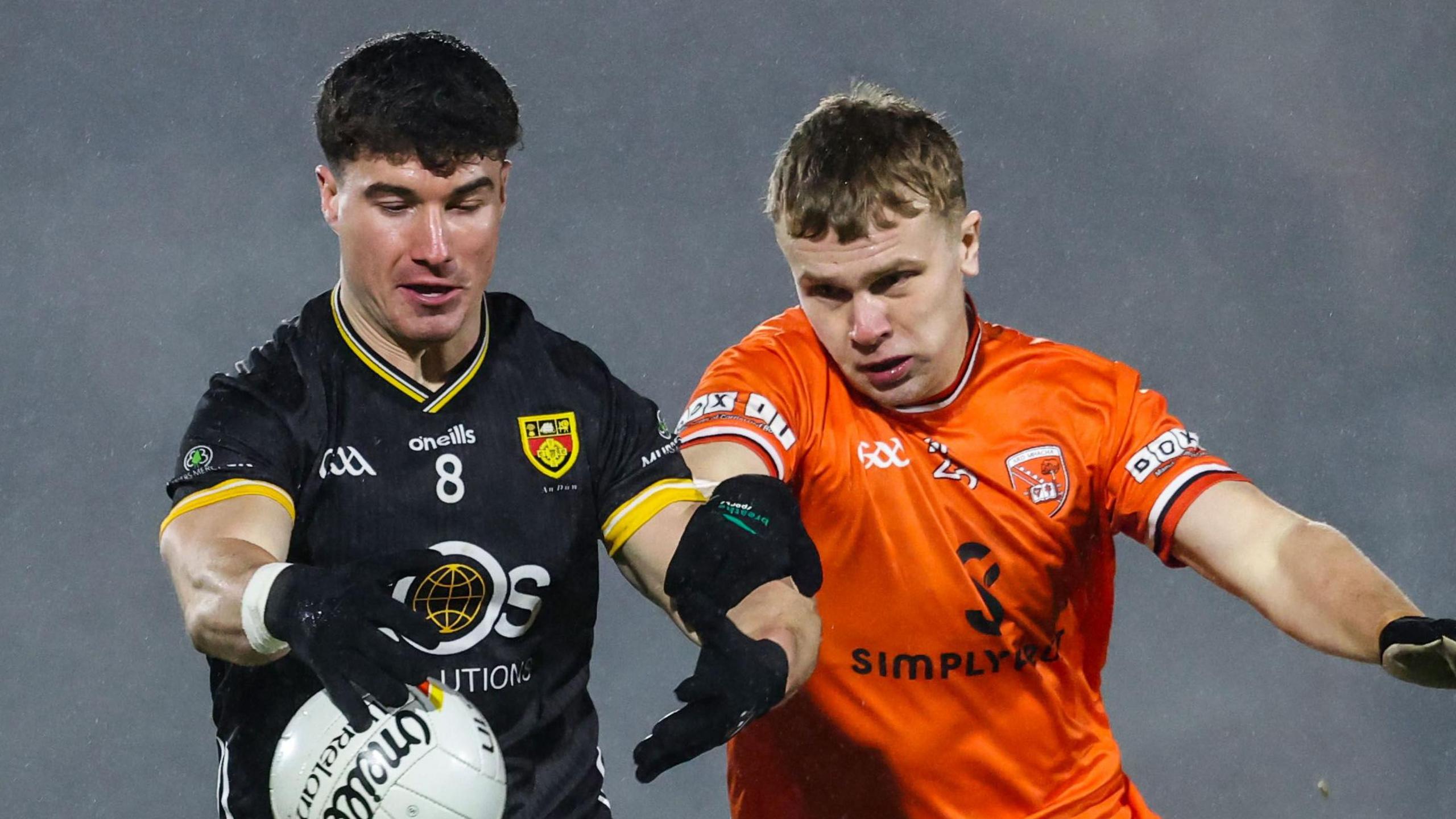 Aaron O'Neill of Armagh battles with Daniel Guinness of Down