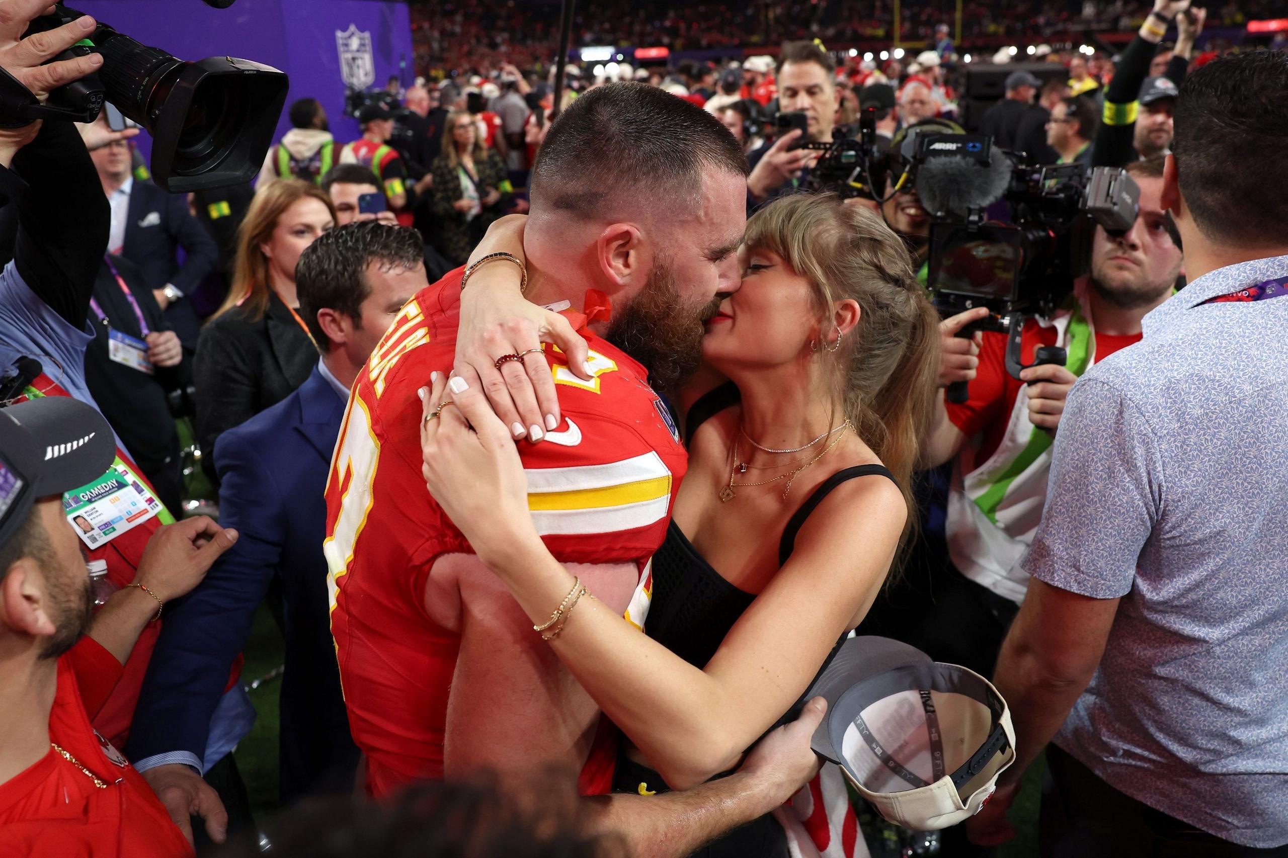 Travis Kelce and Taylor Swift kiss after the Kansas City Chiefs' win over the San Francisco 49ers in the Super Bowl in Las Vegas