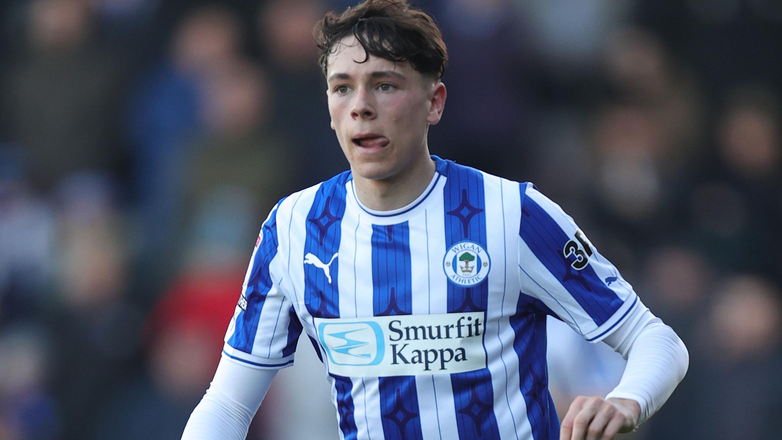 Defender Luke Chambers in action for Wigan