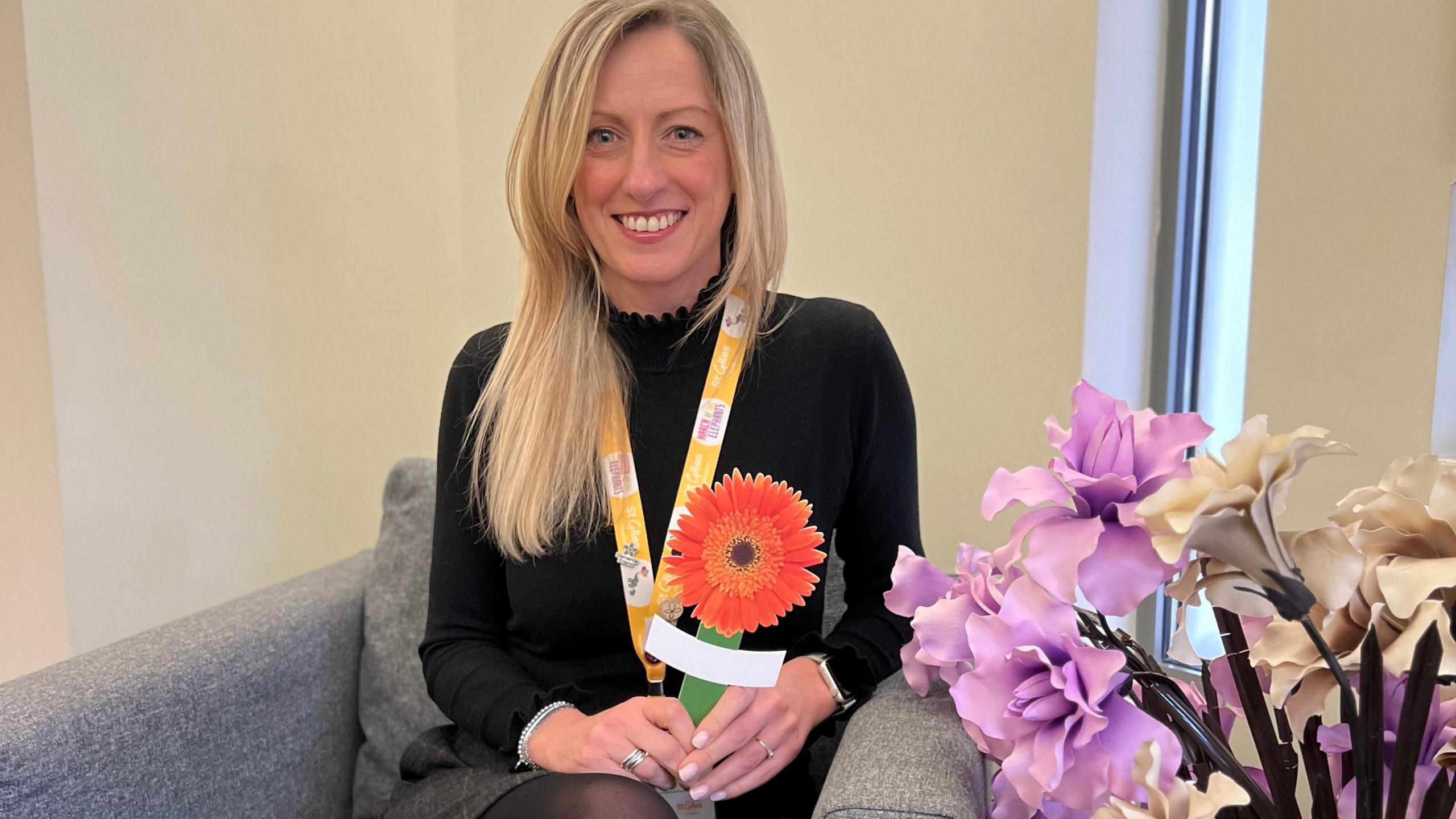 Ali Callear holding Gerbera flower peg