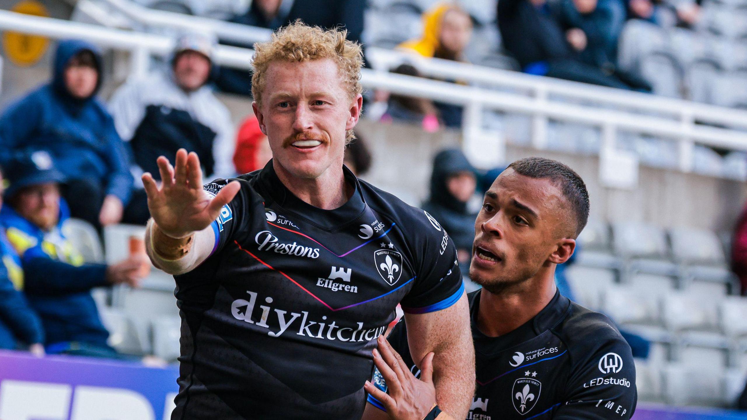 Wakefield's Lachlan Walmsley celebrates after scoring a try
