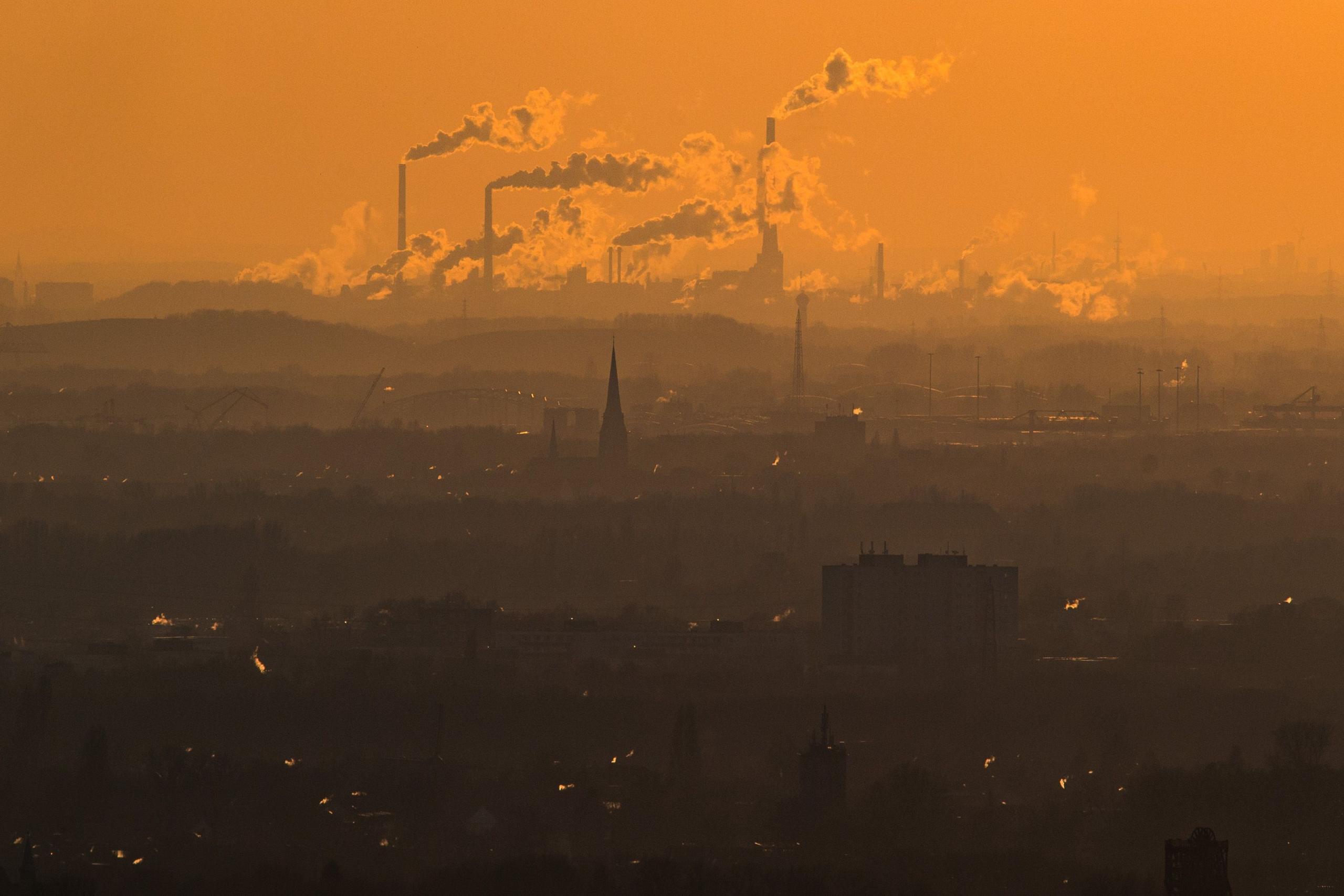 Steam and exhaust rise from different companies on a cold winter day in Oberhausen, Germany.