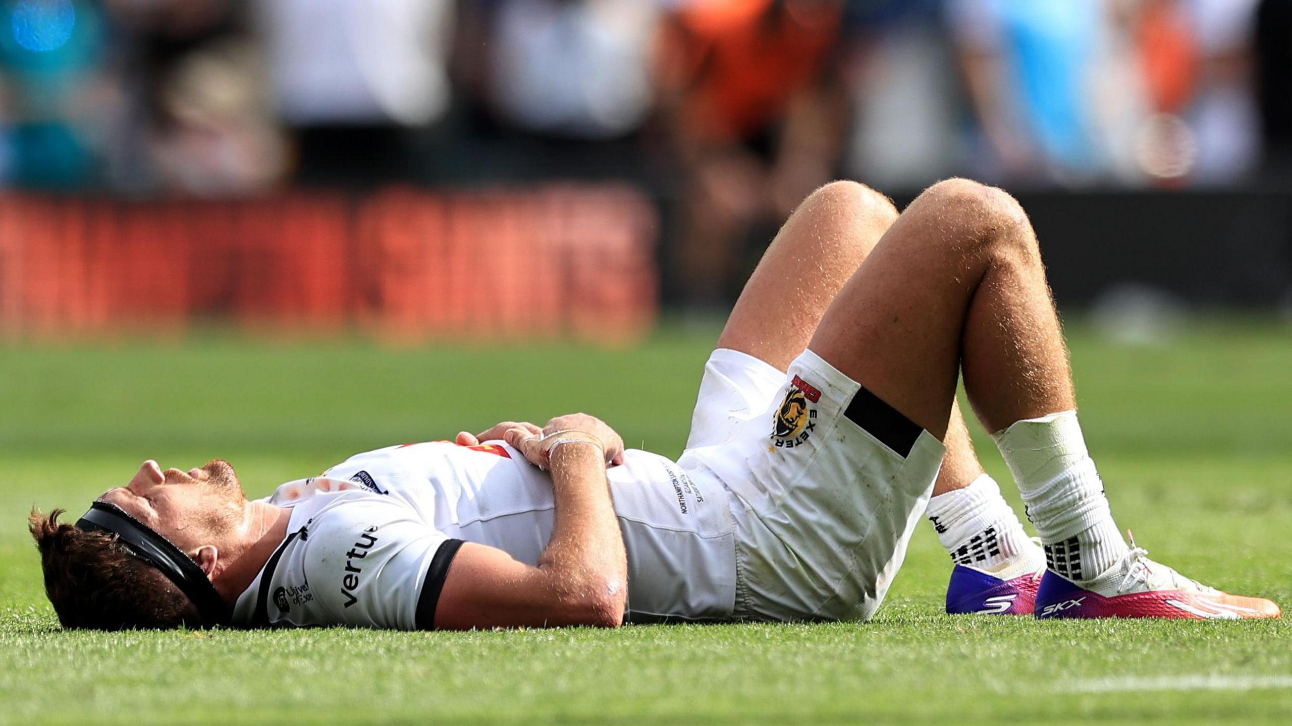 Henry Slade lies down dejected