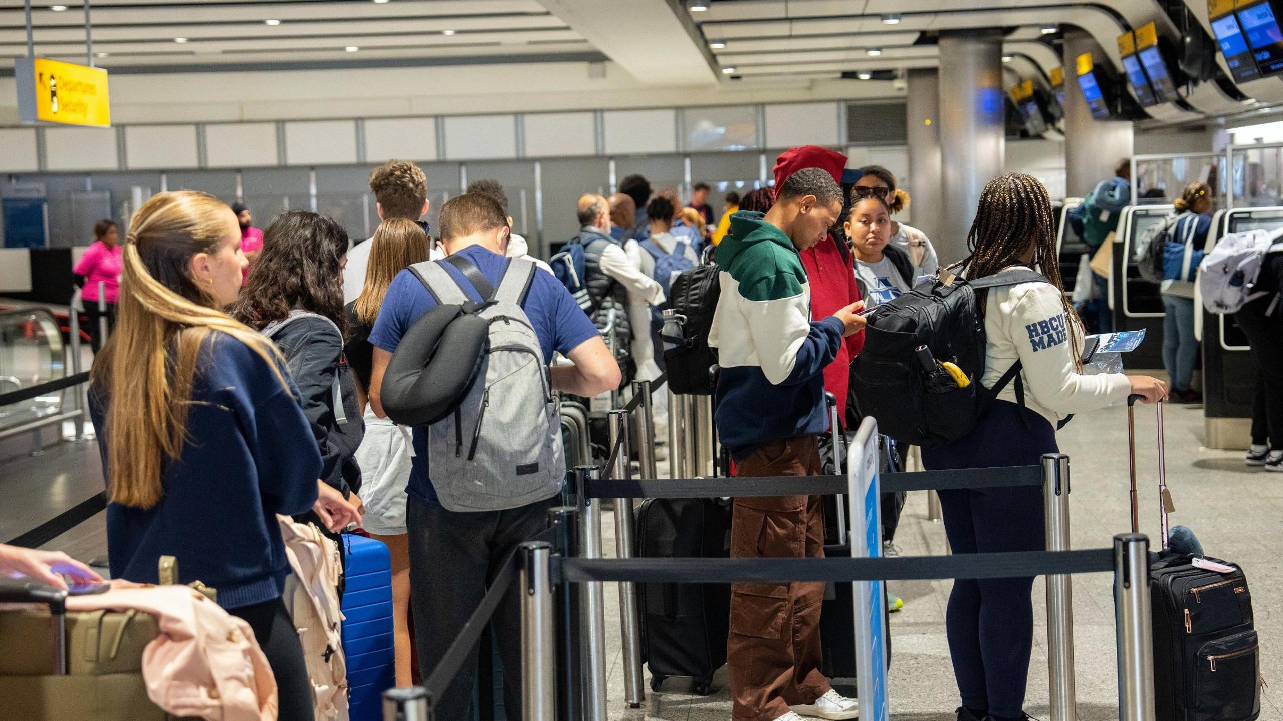 People queueing at Heathrow Airport in 2023.