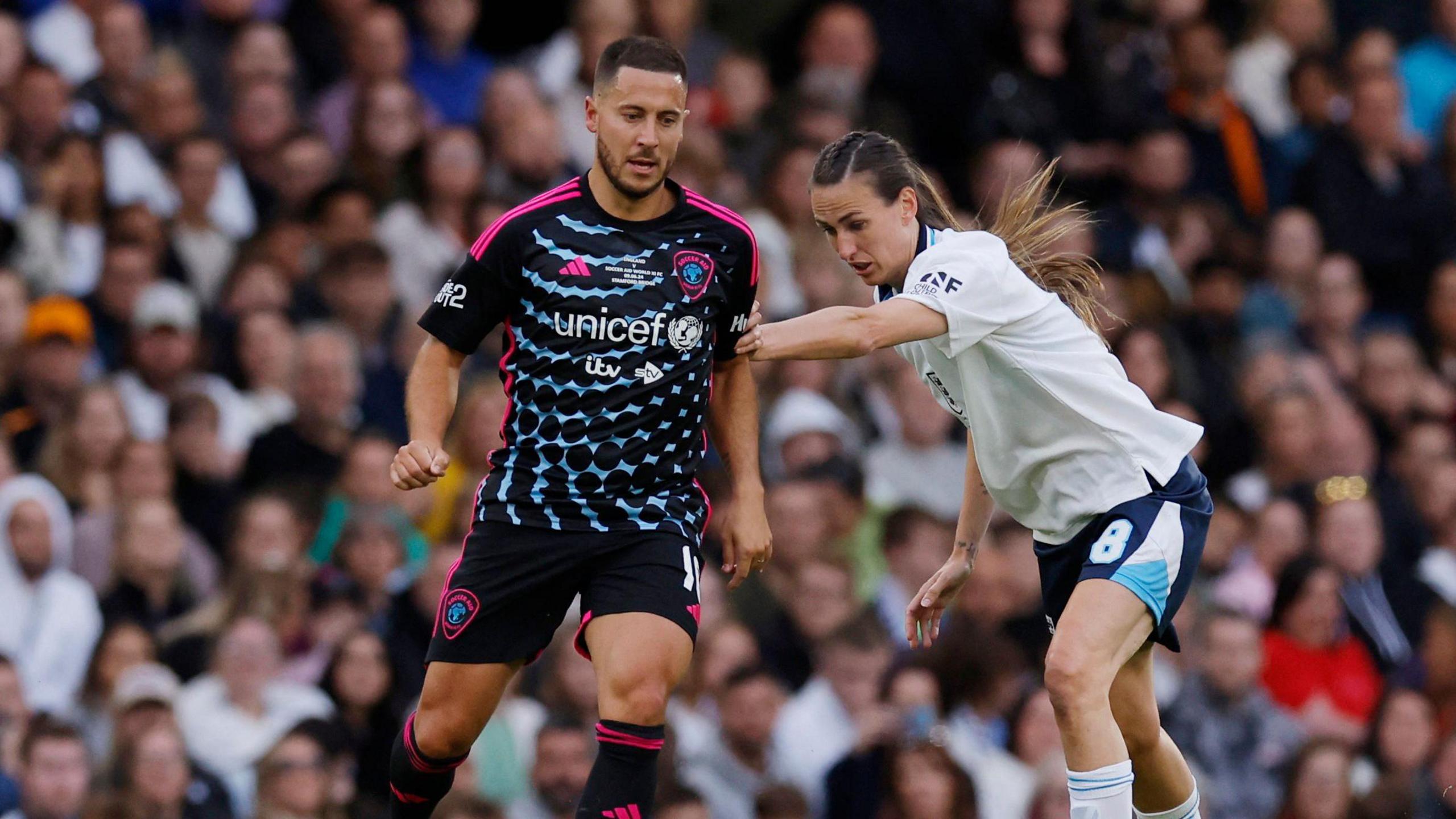 Eden Hazard runs with the ball