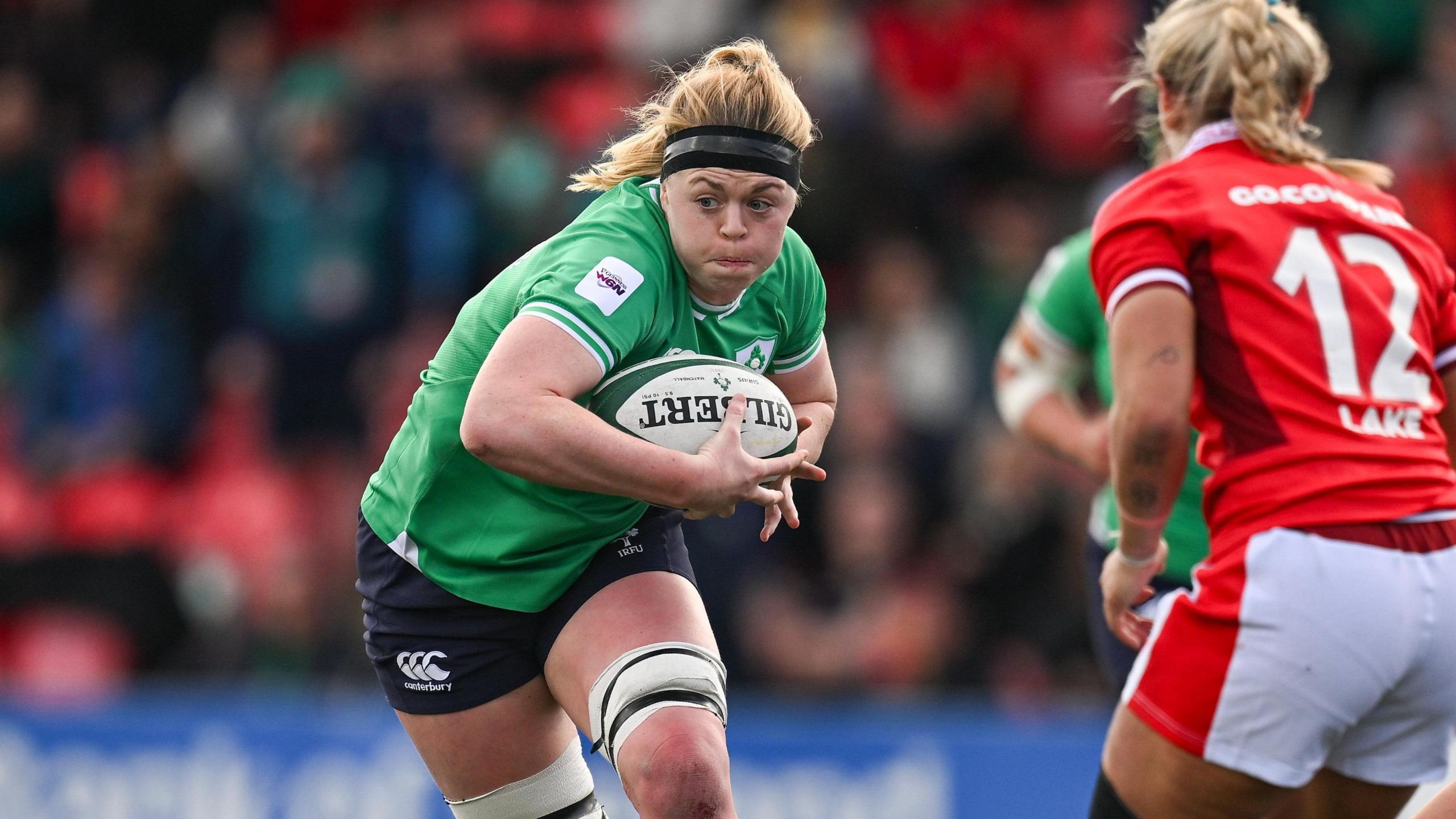 Sam Monaghan carries the ball against Wales