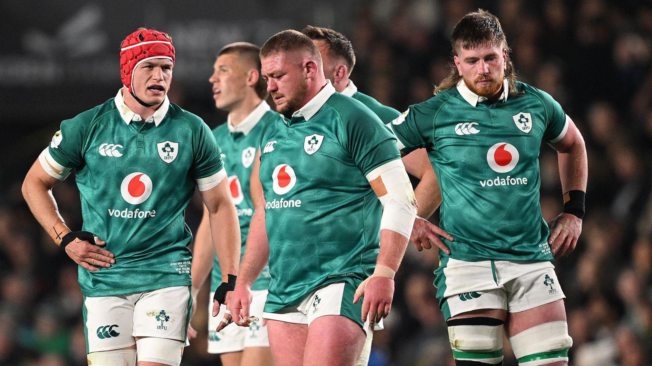 Josh van der Flier, Tadhg Furlong and Joe McCarthy look dejected during Ireland's defeat by New Zealand