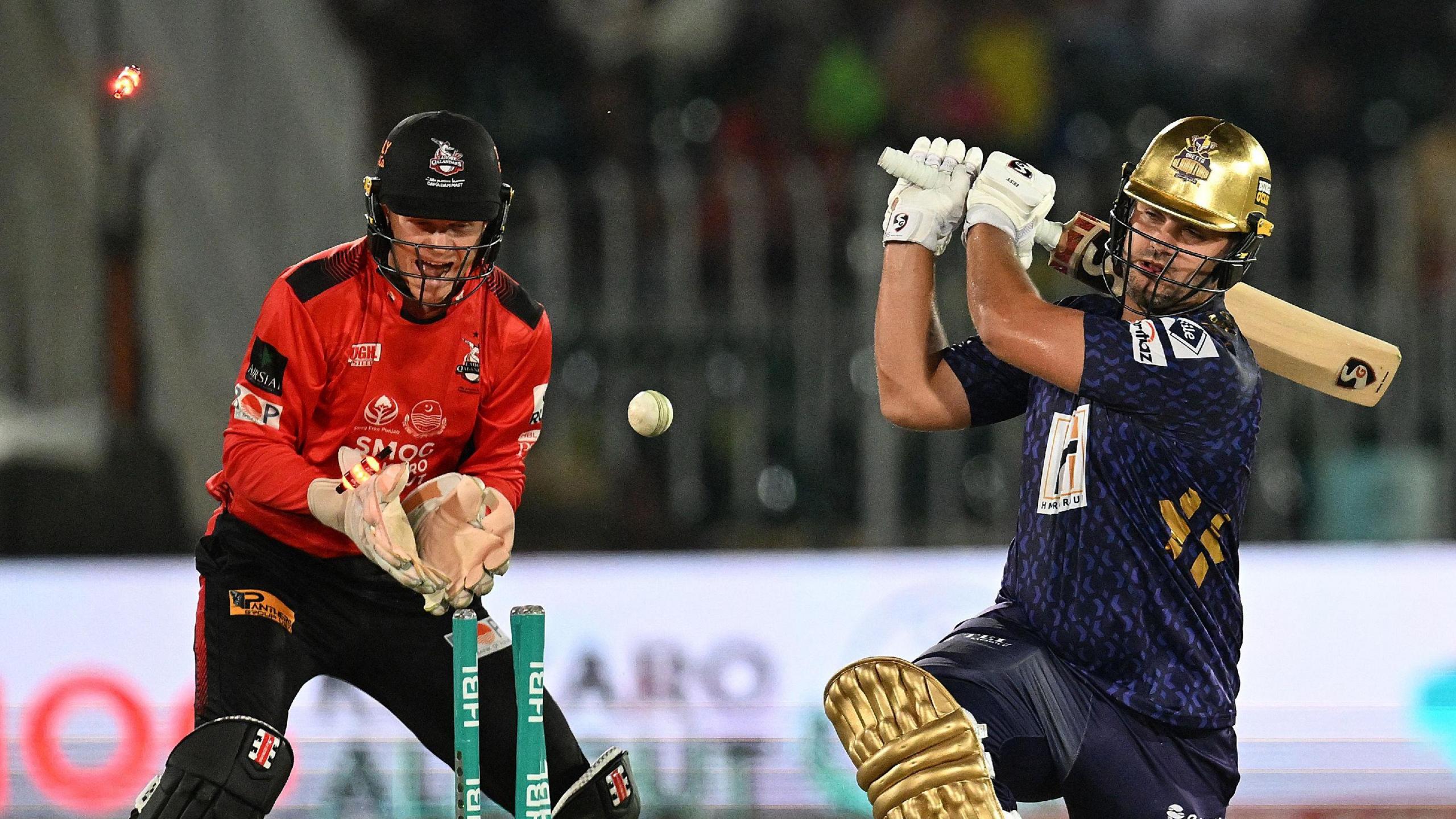 Lahore Qalandars' wicketkeeper Sam Billings celebrates as Quetta Gladiators' batsman Rilee Rossouw is bowled