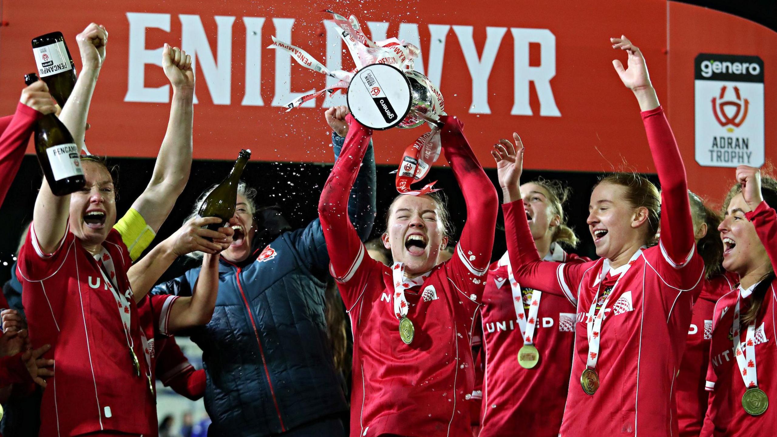 Wrexham player lift the Adran Premier Trophy