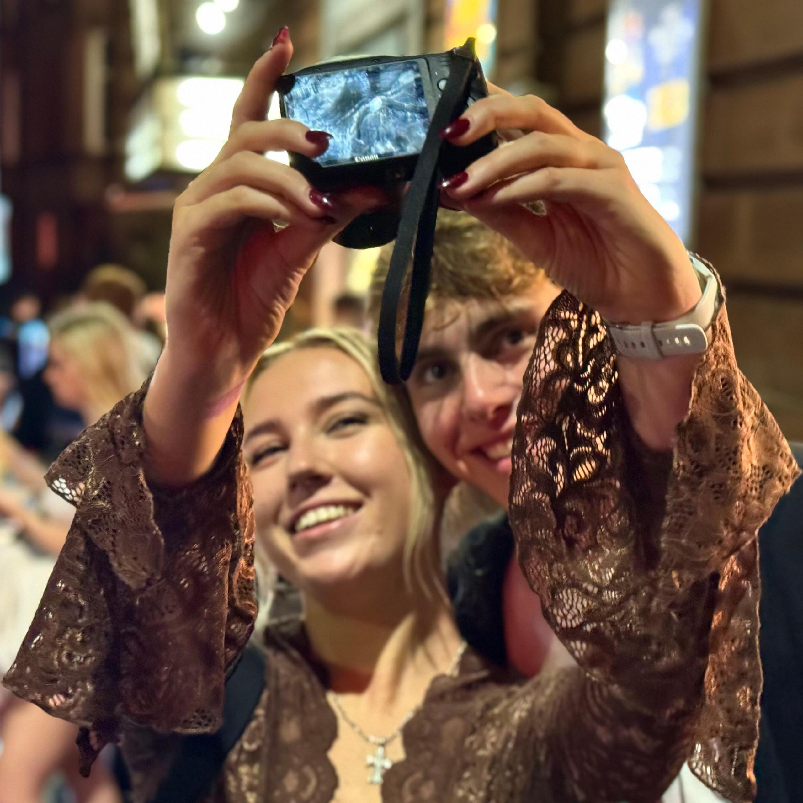 Clubbers taking a selfie outside The Shed 