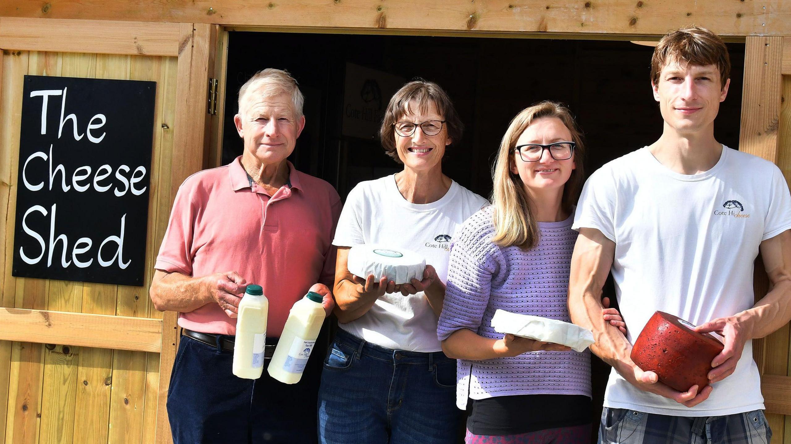 An image of staff at Cote Hill Cheese with some of their produce