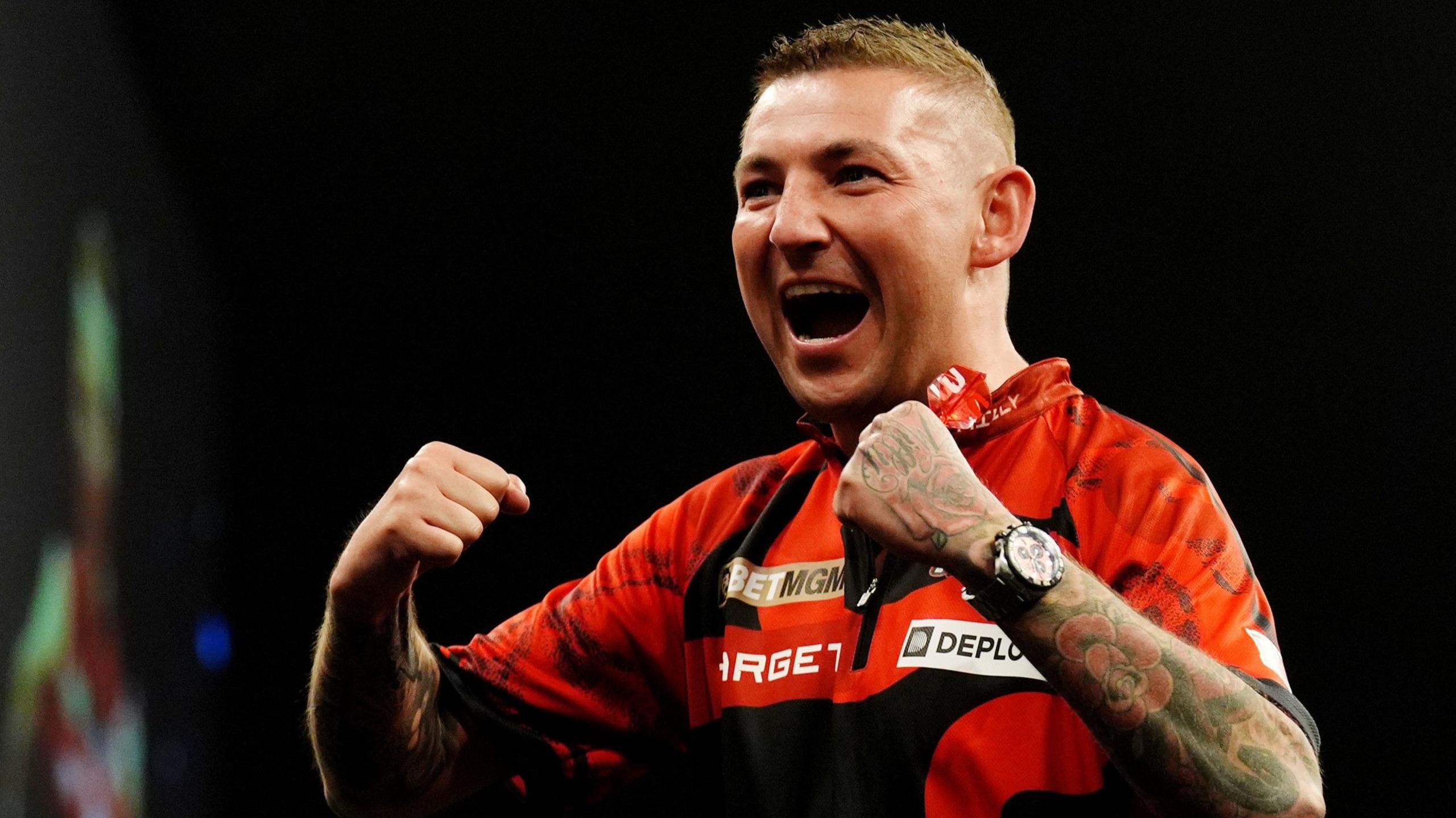 Nathan Aspinall celebrates victory