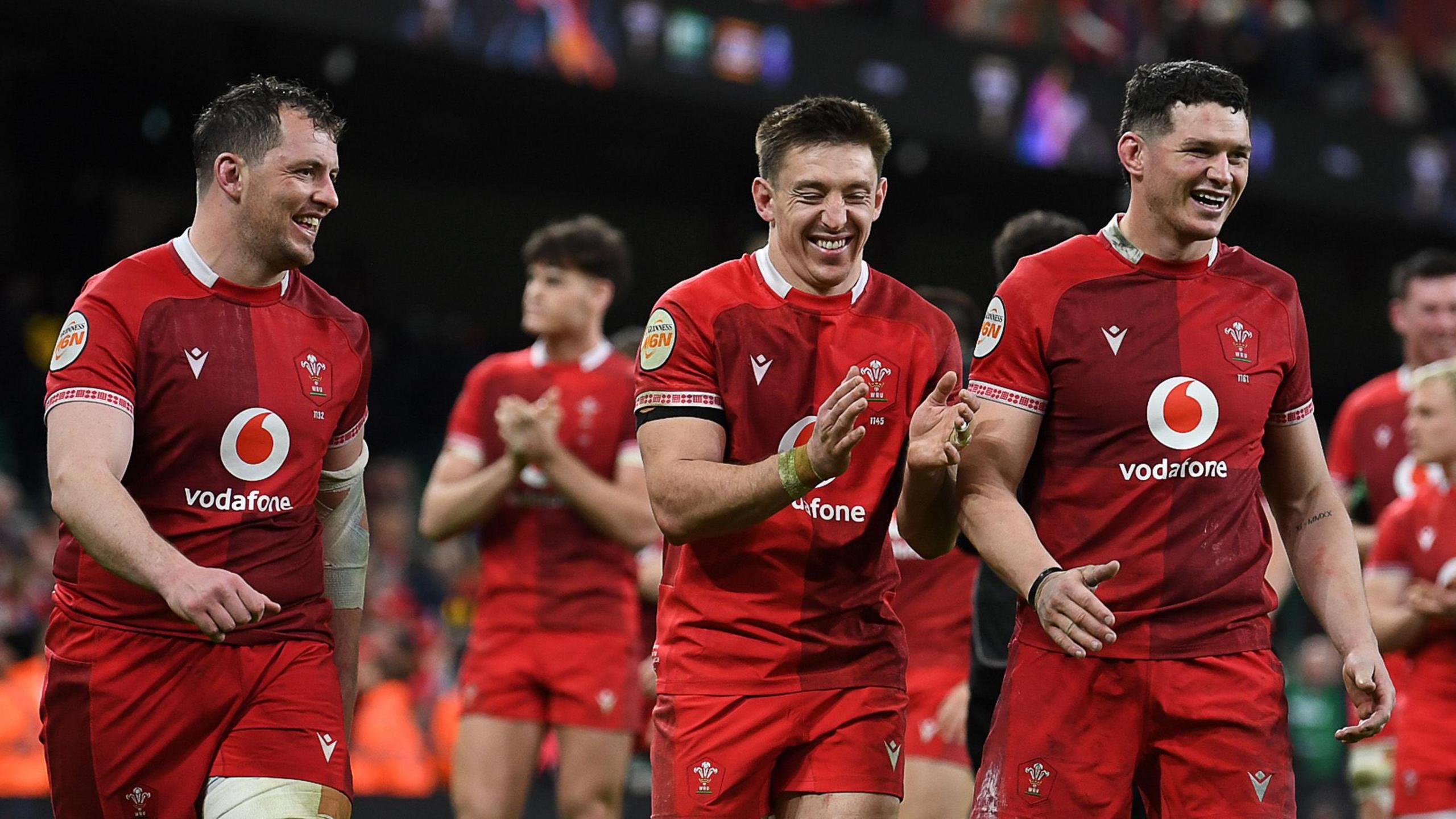 Wales players Ryan Elias, Josh Adams and James Botham celebrate after beating Italy