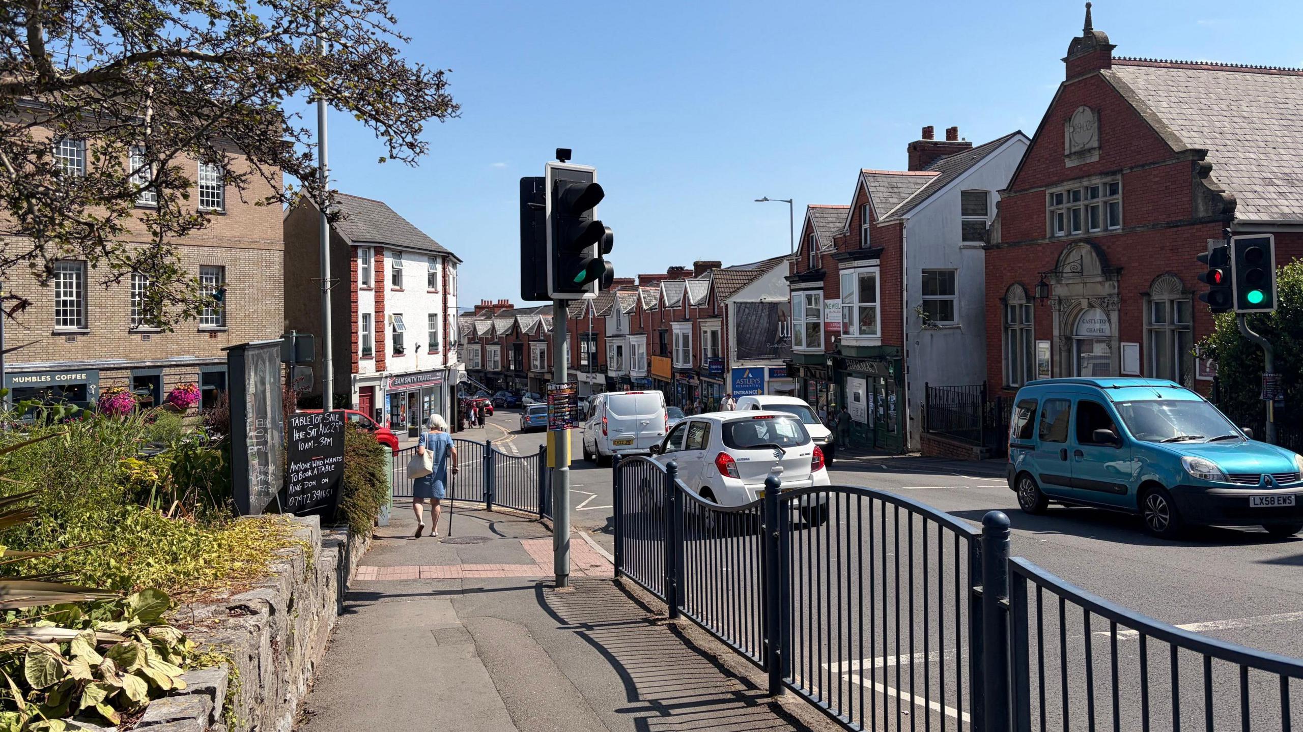 Cars and shops on Newton Road in Mumbles