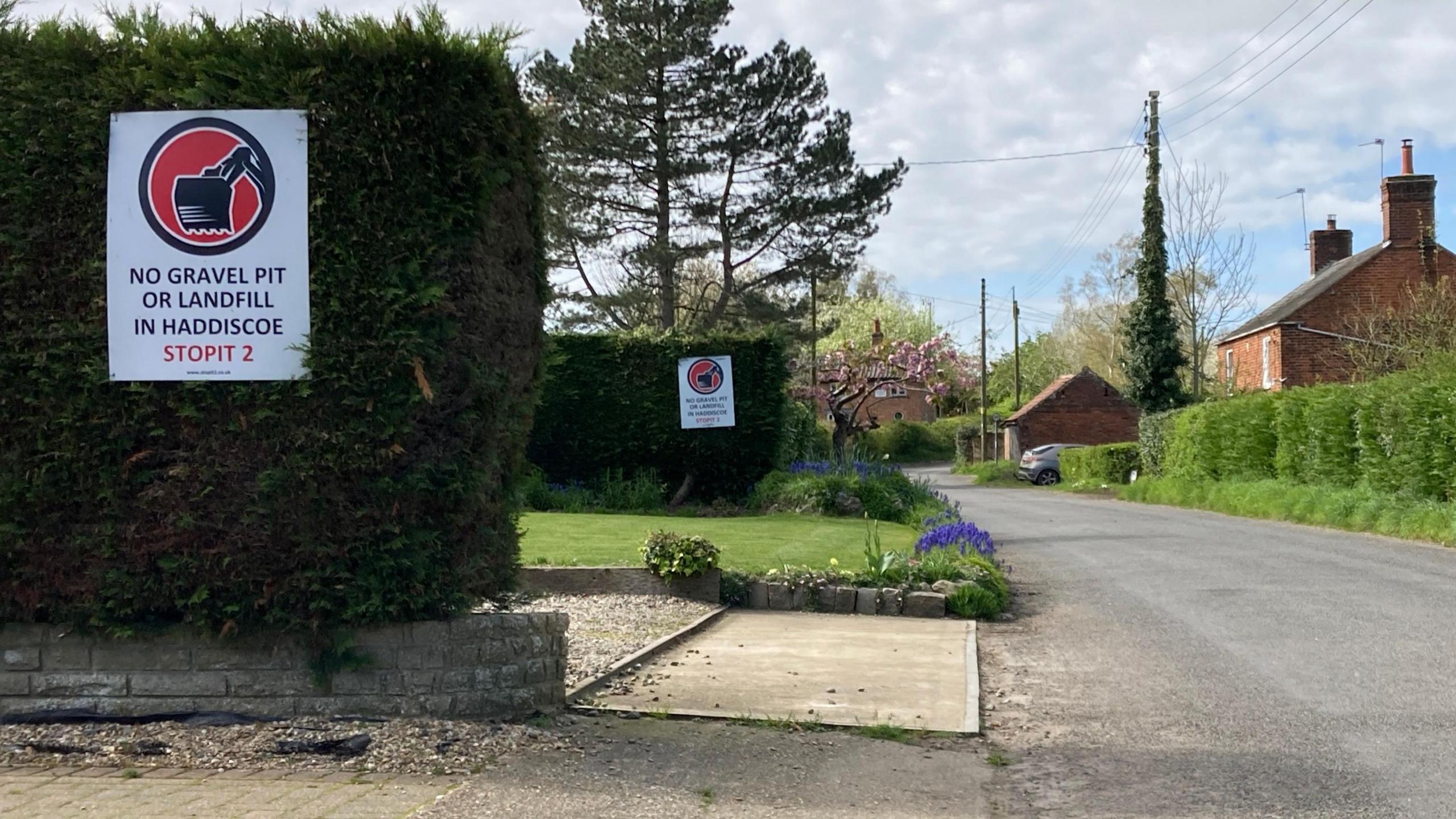 Signs saying 'No gravel pit or landfill in Haddiscoe"