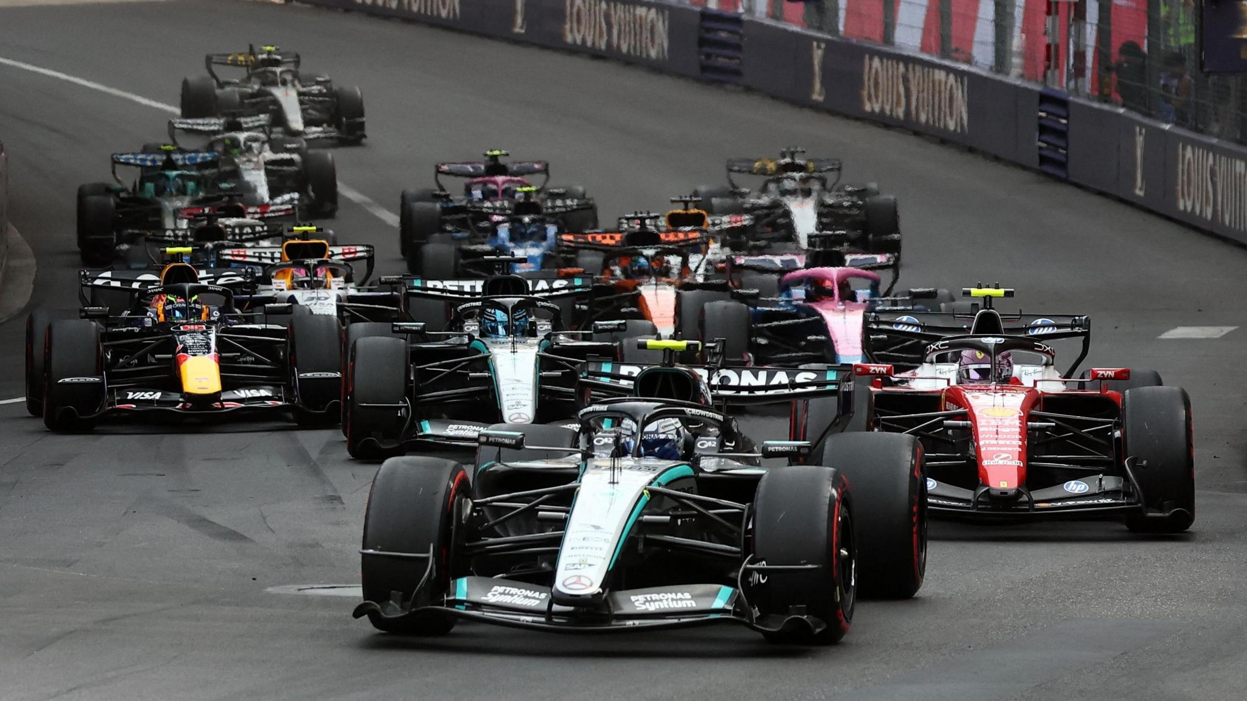 Kimi Antonelli leads the field into the first corner as the Monaco Grand Prix restarts after a red flag