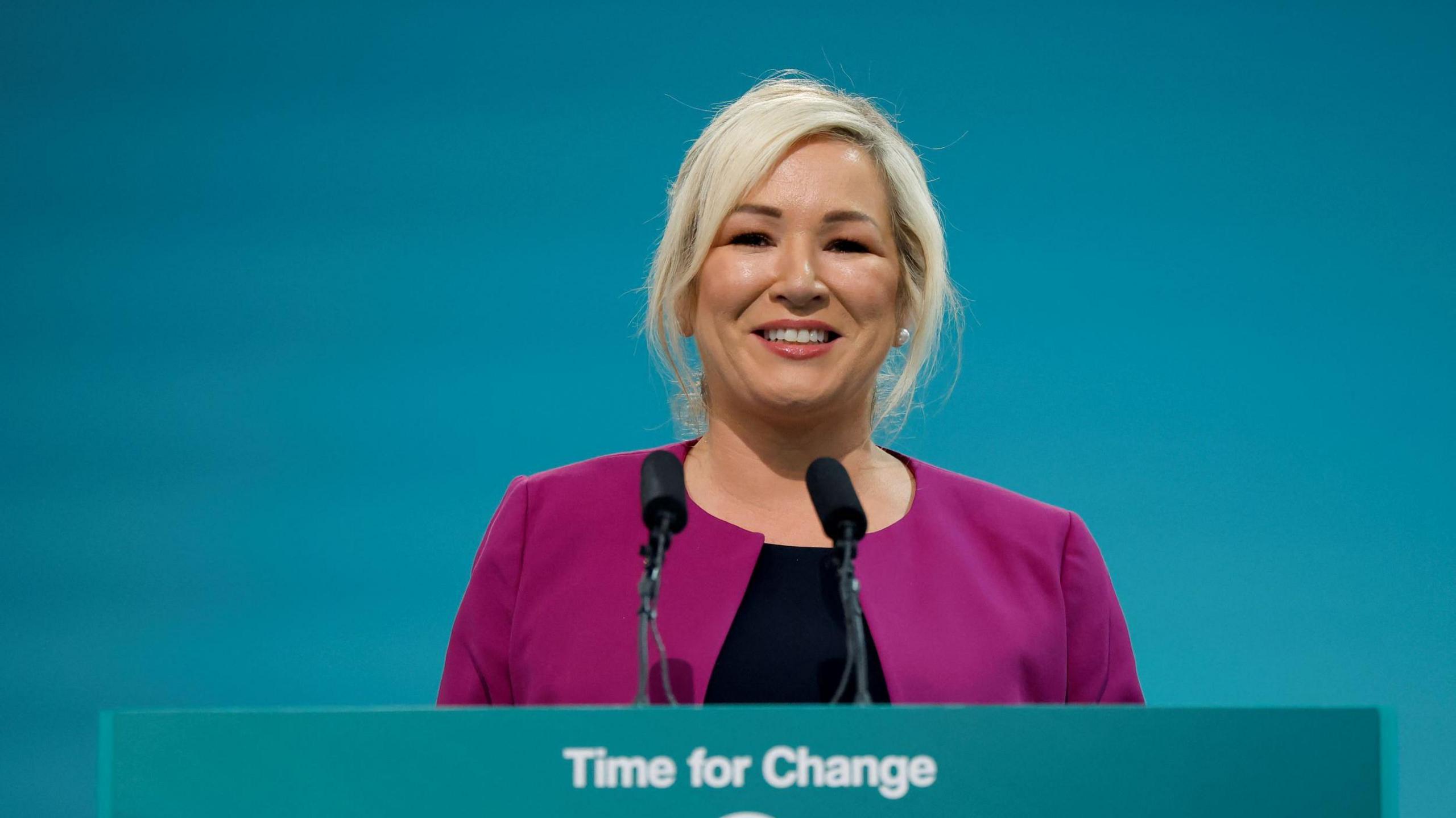 Michelle O'Neill smiling as she addresses delegates at the Sinn Féin ard fheis in Athlone