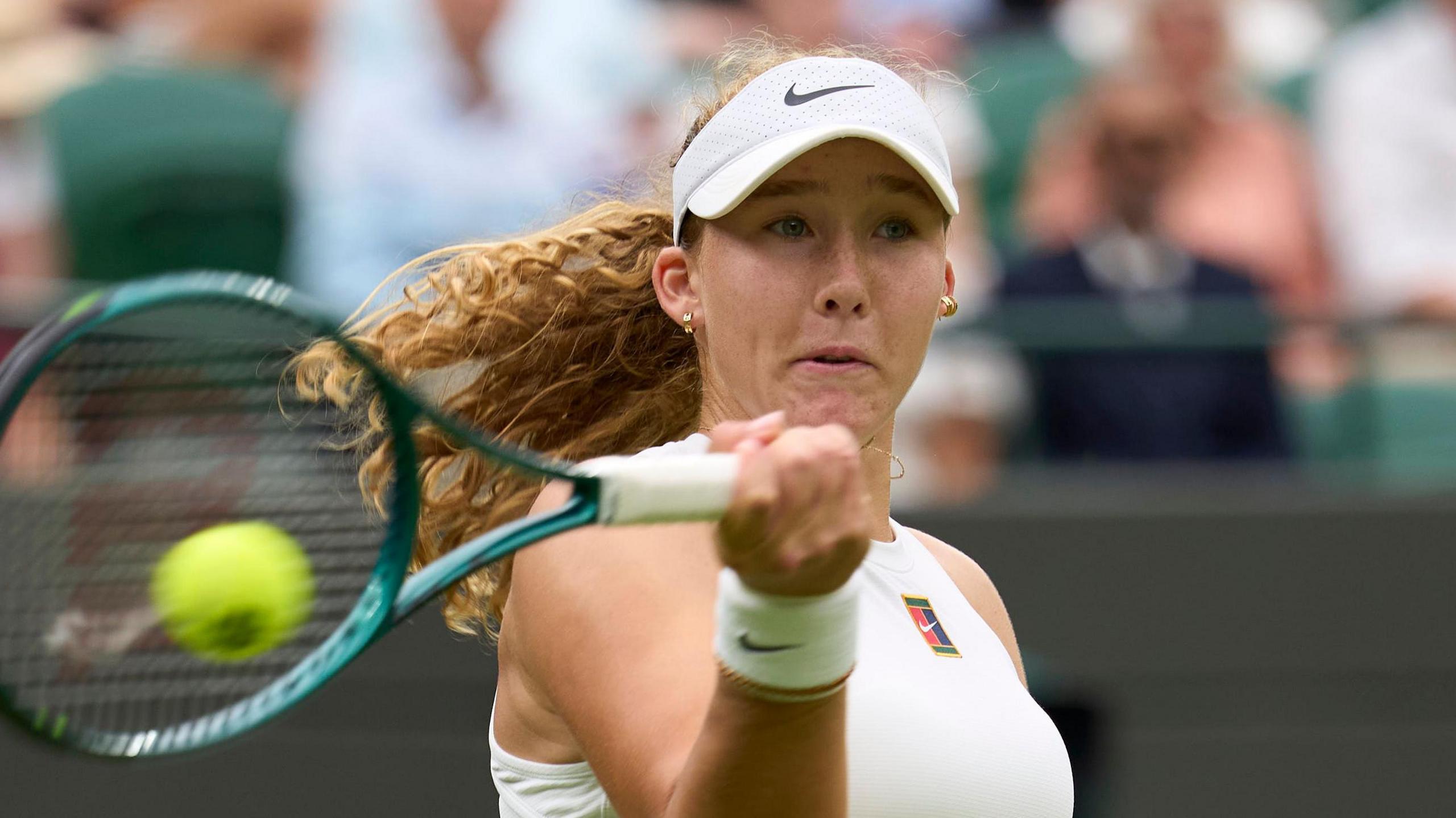 Mirra Andreeva hits a forehand at Wimbledon