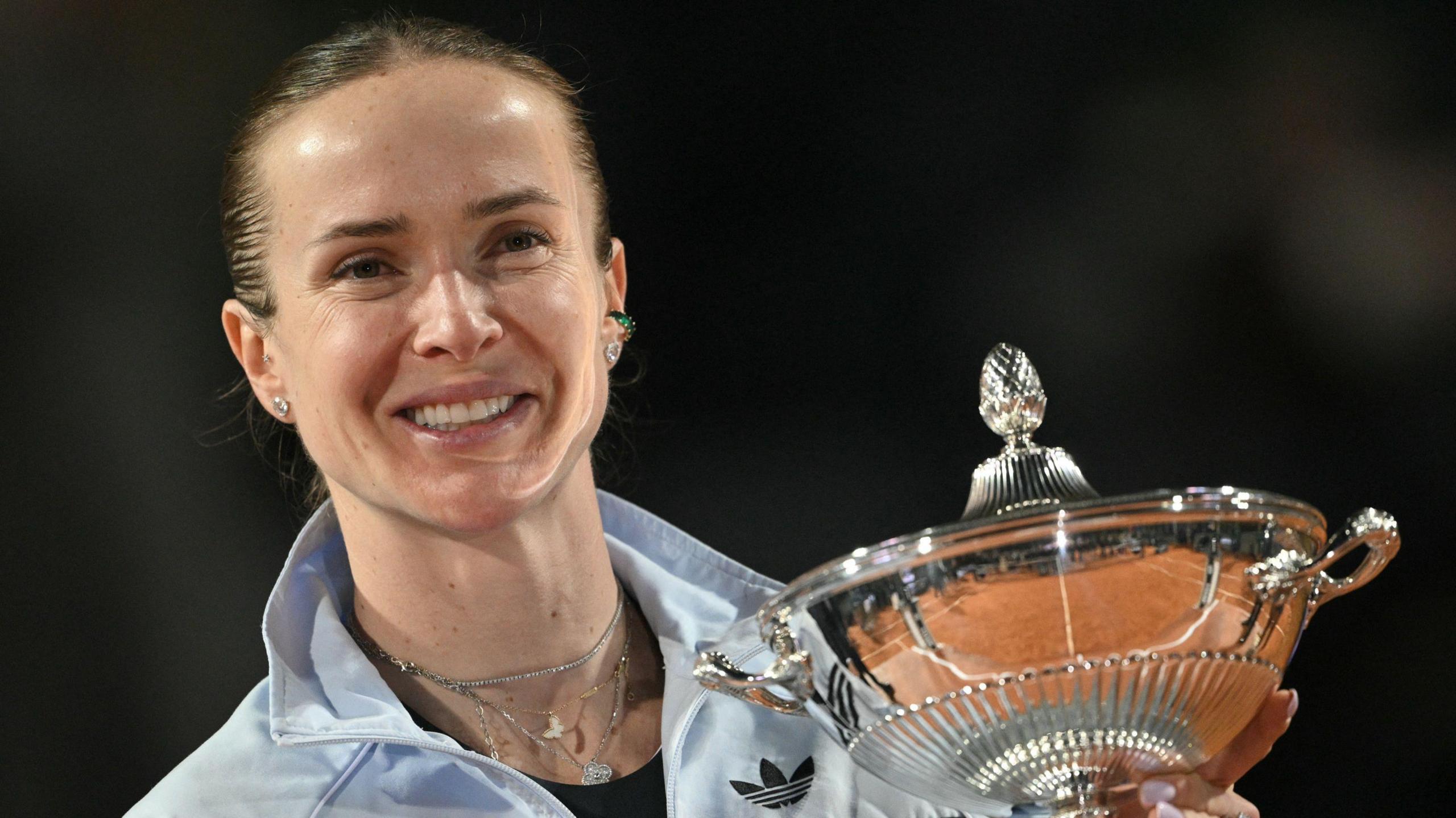 Ukraine's Elina Svitolina holds the trophy after winning the Italian Open final