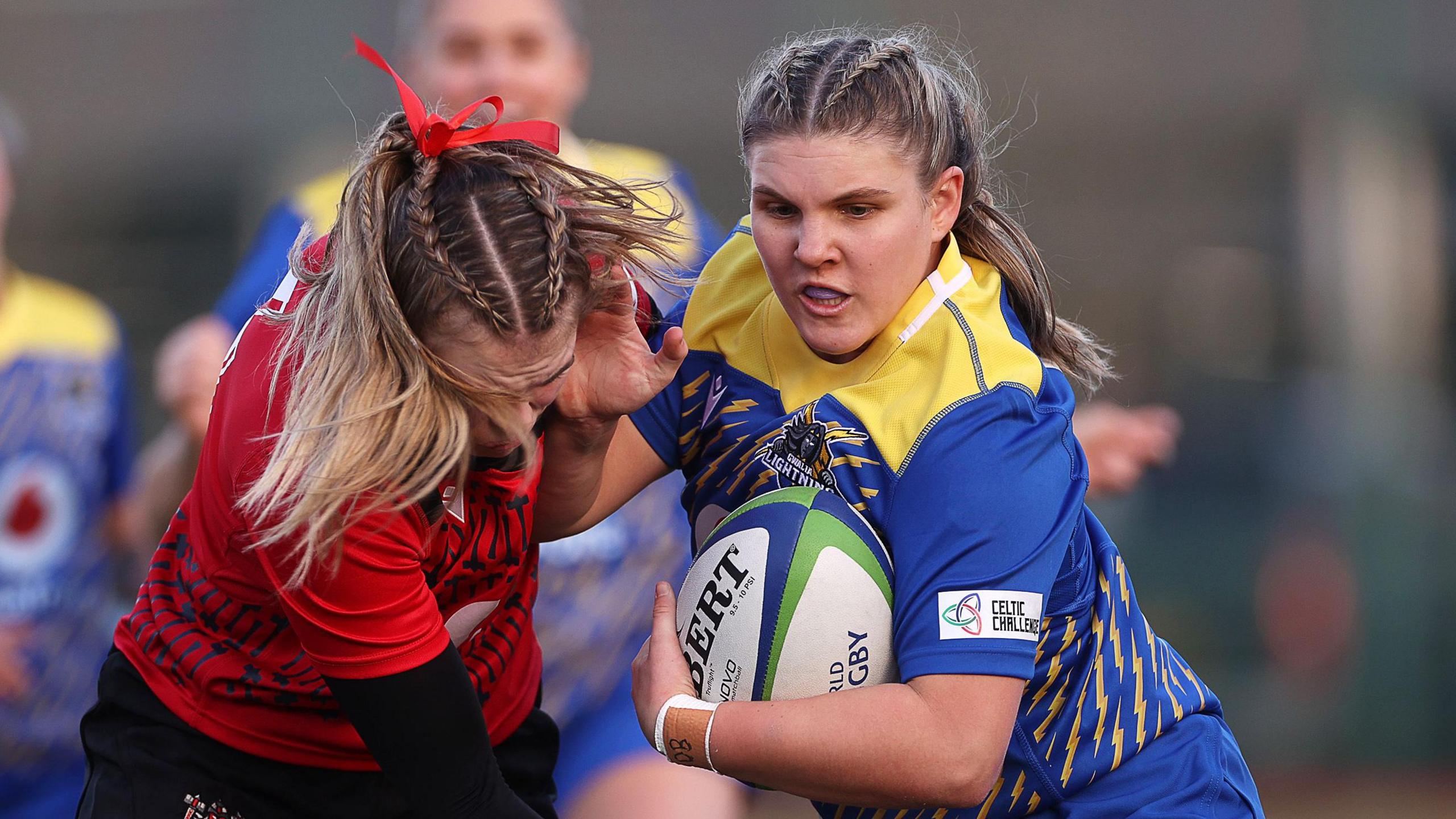  Molly Anderson-Thomas of Gwalia Lightning is tackled by Ellie Tromans of Brython Thunder