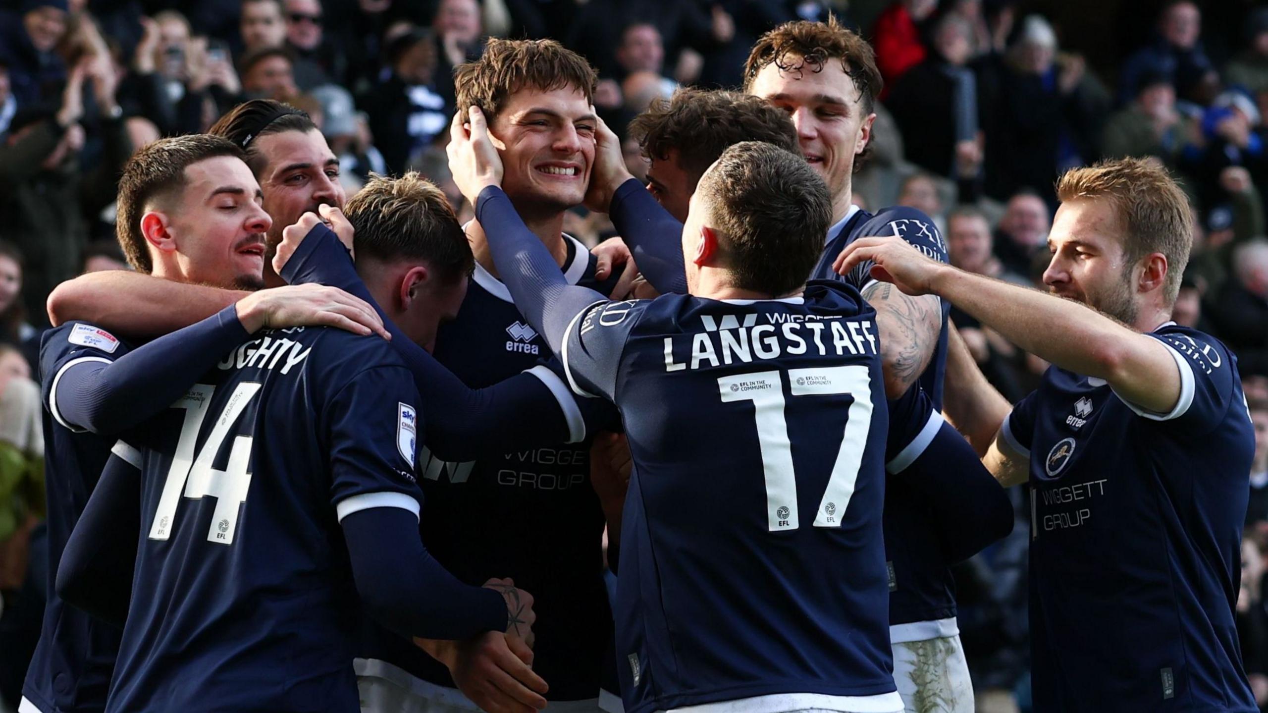Millwall players celebrate their second goal against Charlton Athletic