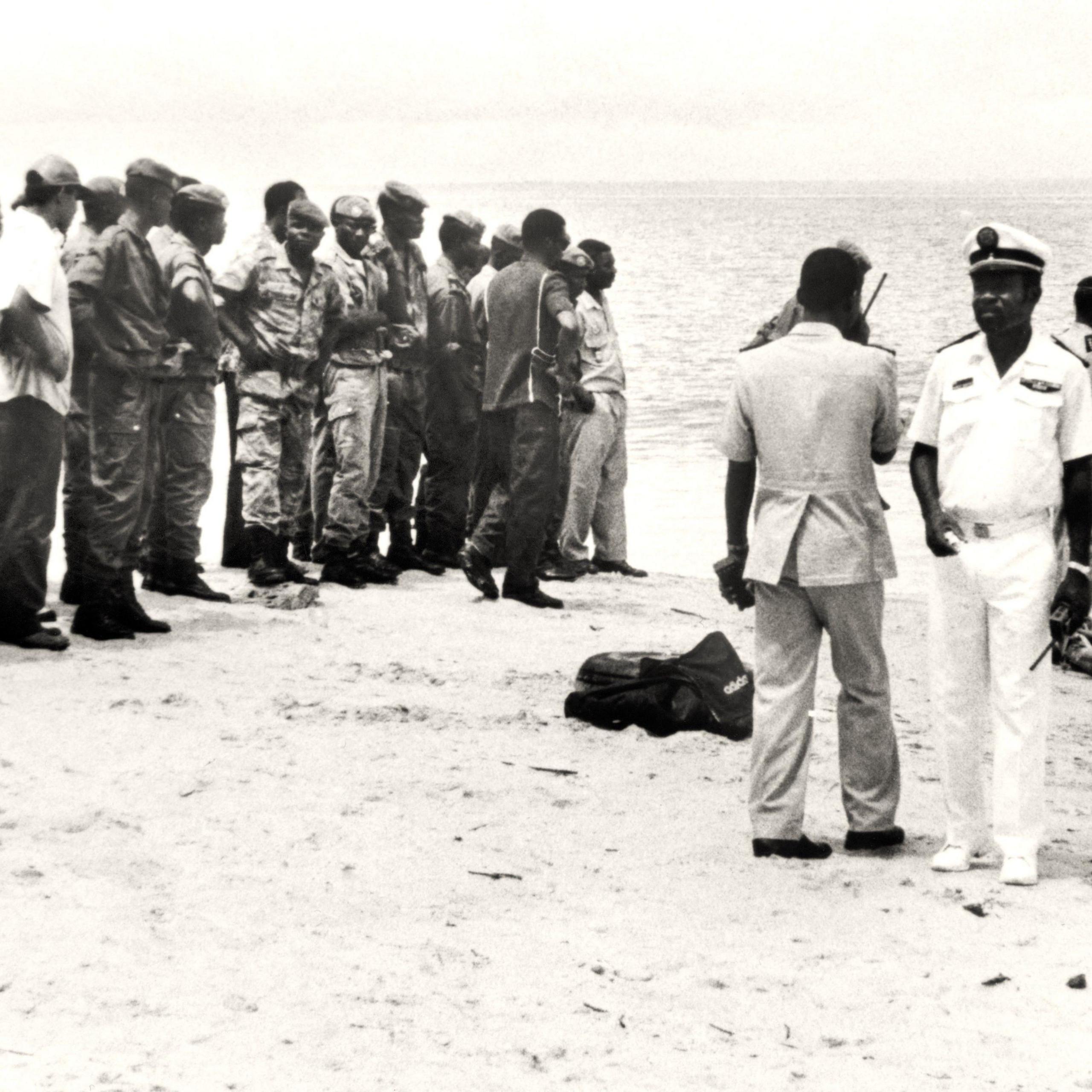 Gabonese soldiers search a beach for remains of the lost Zambia national team in 1993