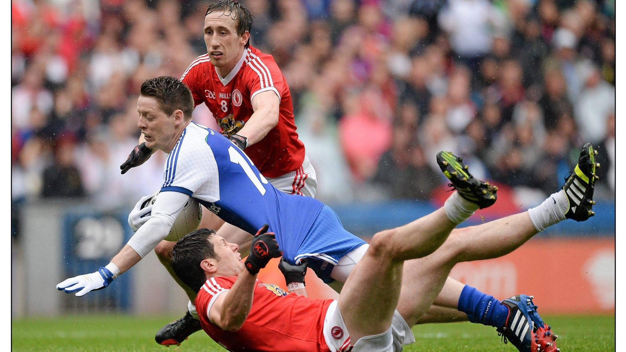 Tyrone's Sean Cavanagh with Conor McManus of Monaghan 