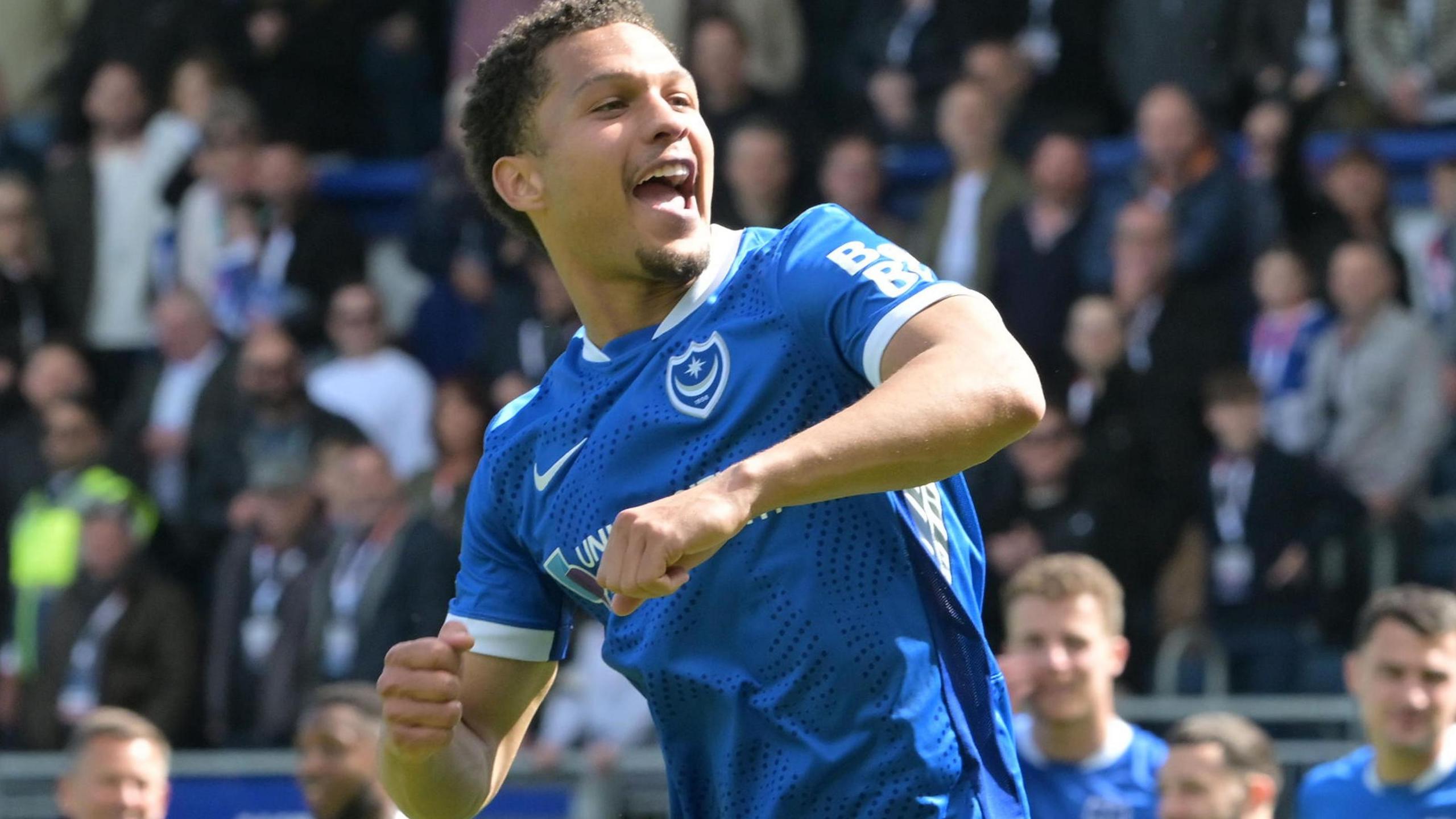 Ibane Bowatt prepares to punch his right arm in the air in celebration at scoring Portsmouth's winner in their huge relegation clash with Leicester City.