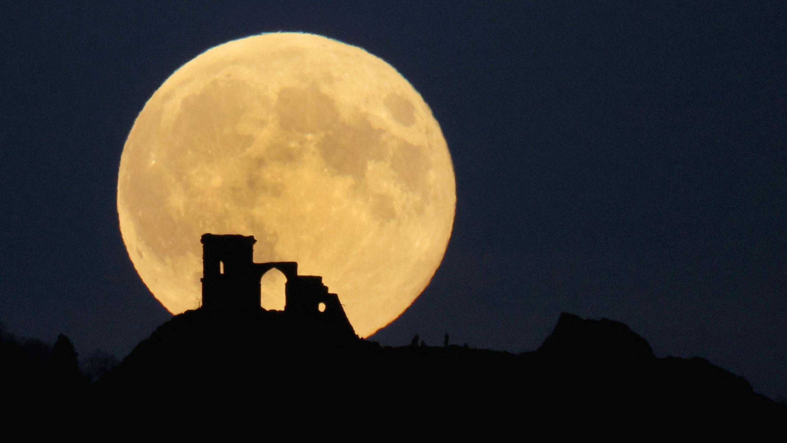 supermoon rises over mow cop in the uk