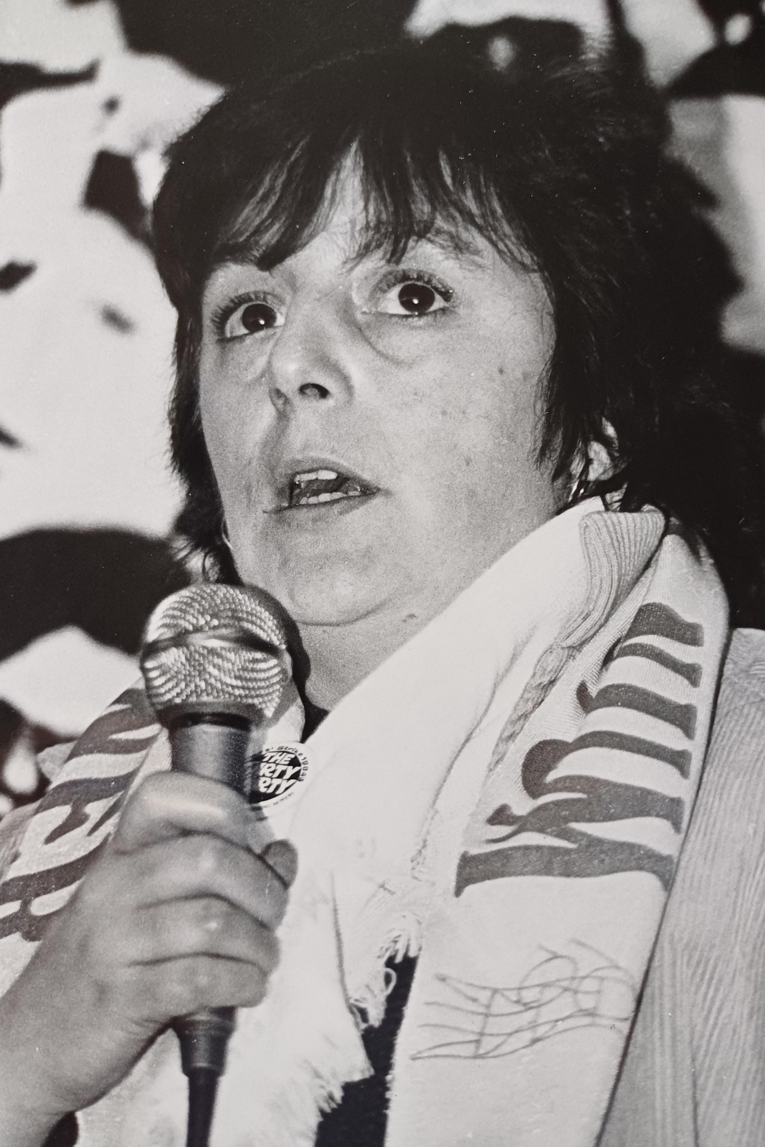 Ann Jones speaking into a microphone