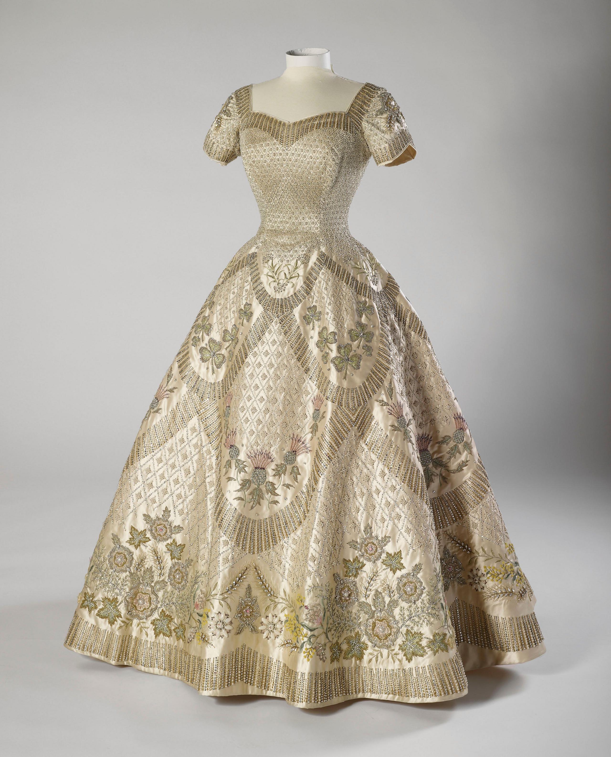 a short sleeved dress with a sweetheart neckline and embroidery across the whole of the skirt and hems