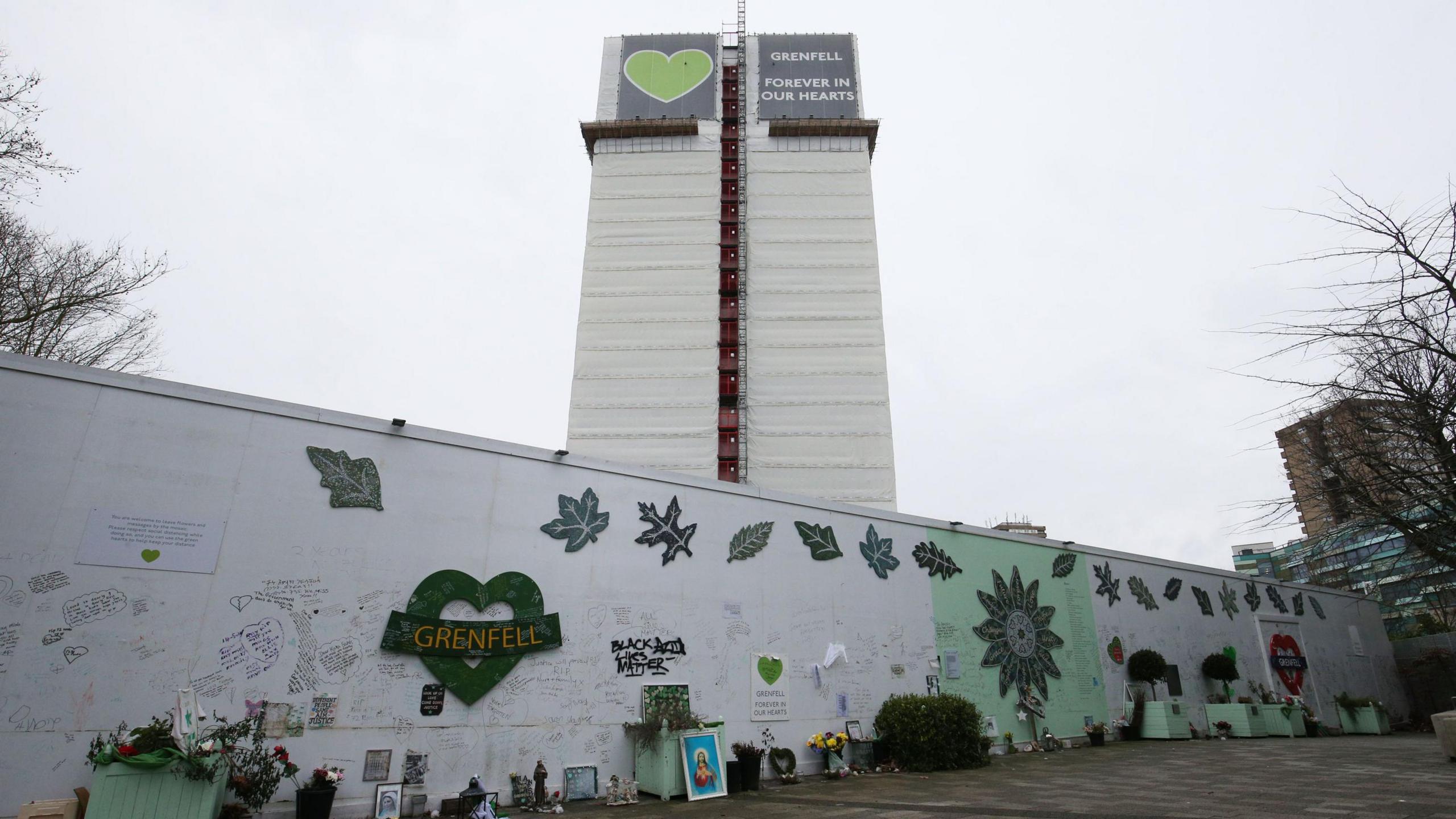 Mural outside Grenfell Tower, with the tower in the background