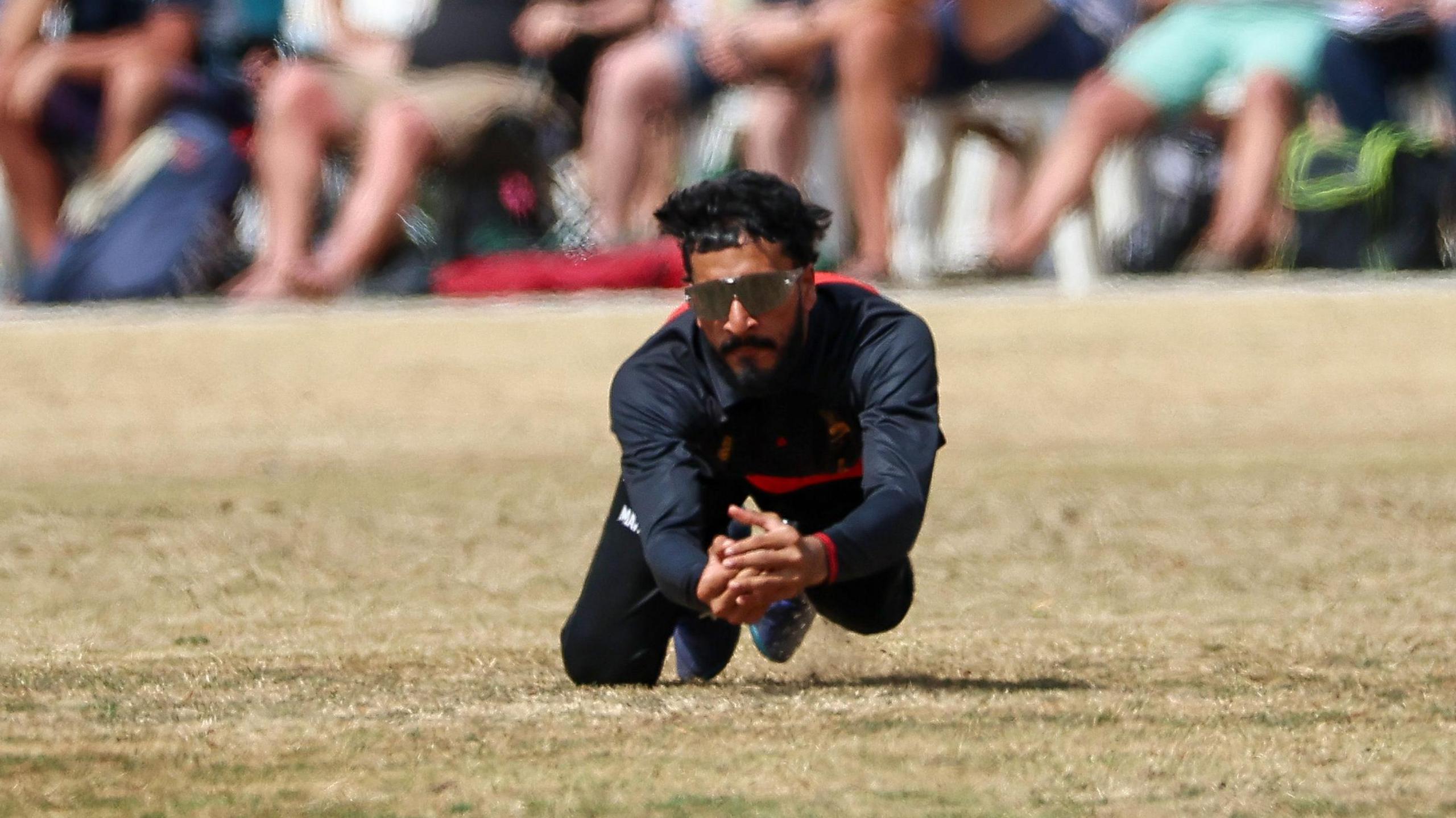 Hamza Shaikh in sunglasses dives on parched outfield in Leicestershire's win over Surrey