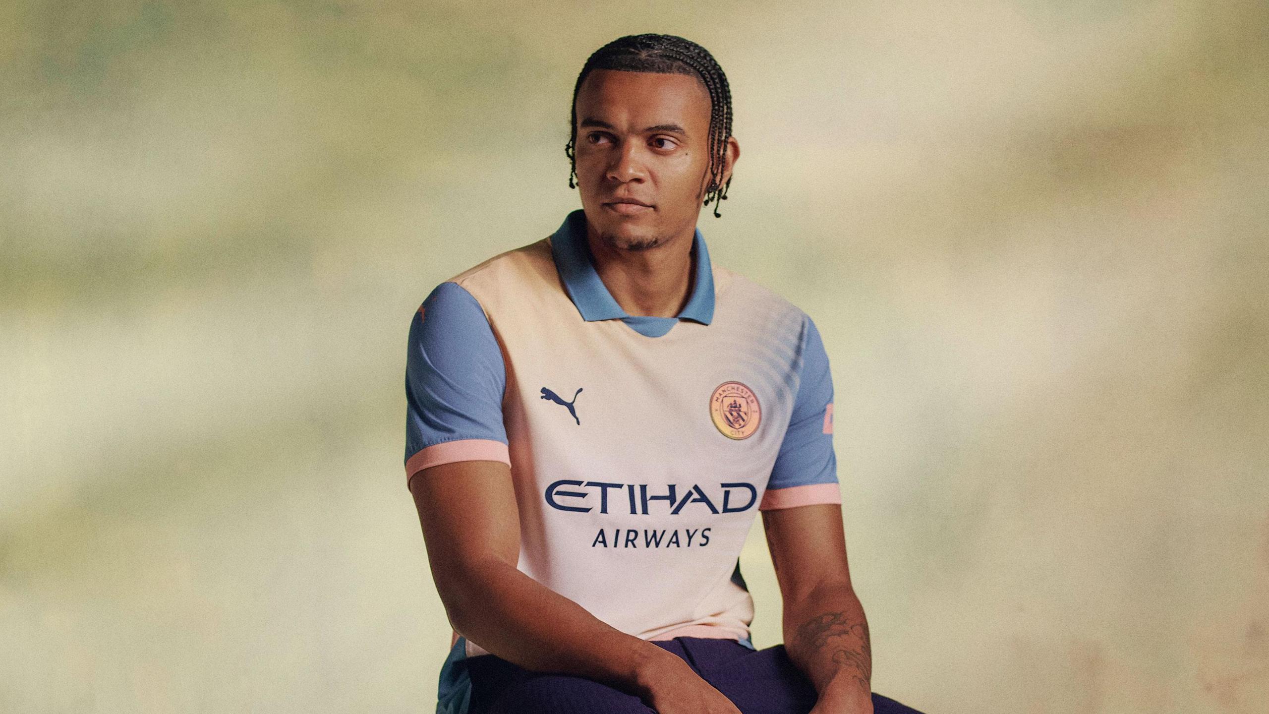 Manuel Akanji models the new Man City fourth kit