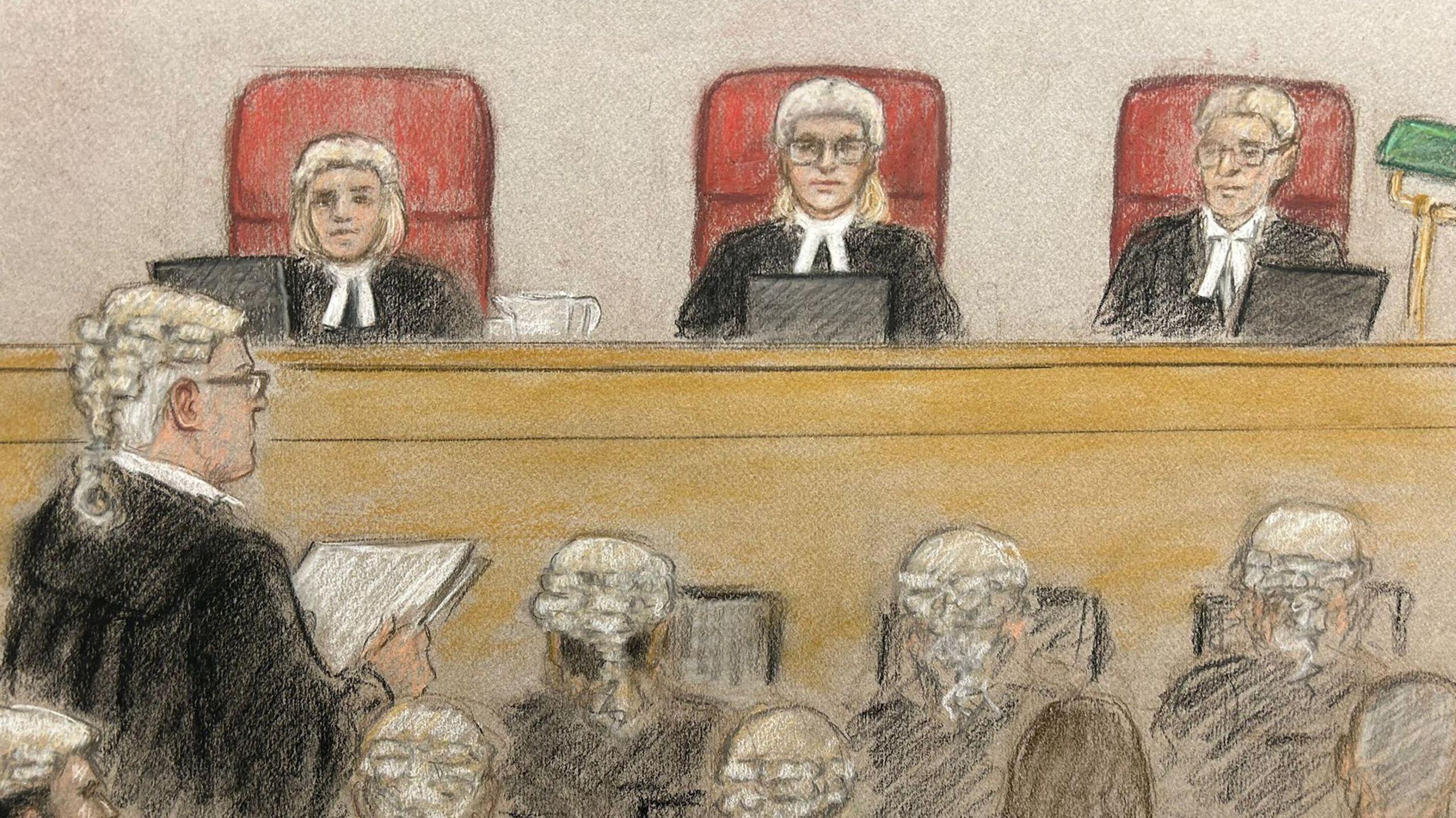 A court sketch showing Sir James Eadie in wig and black court robes addressing the panel of three judges, also in wigs and black robes