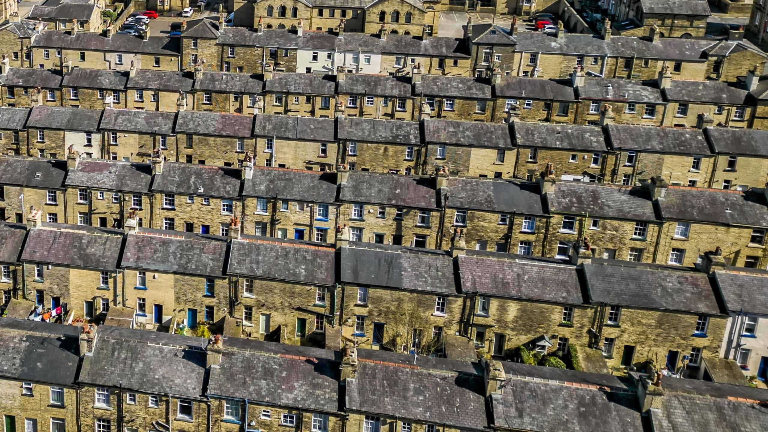 An aerial view of several rows of terraced houses