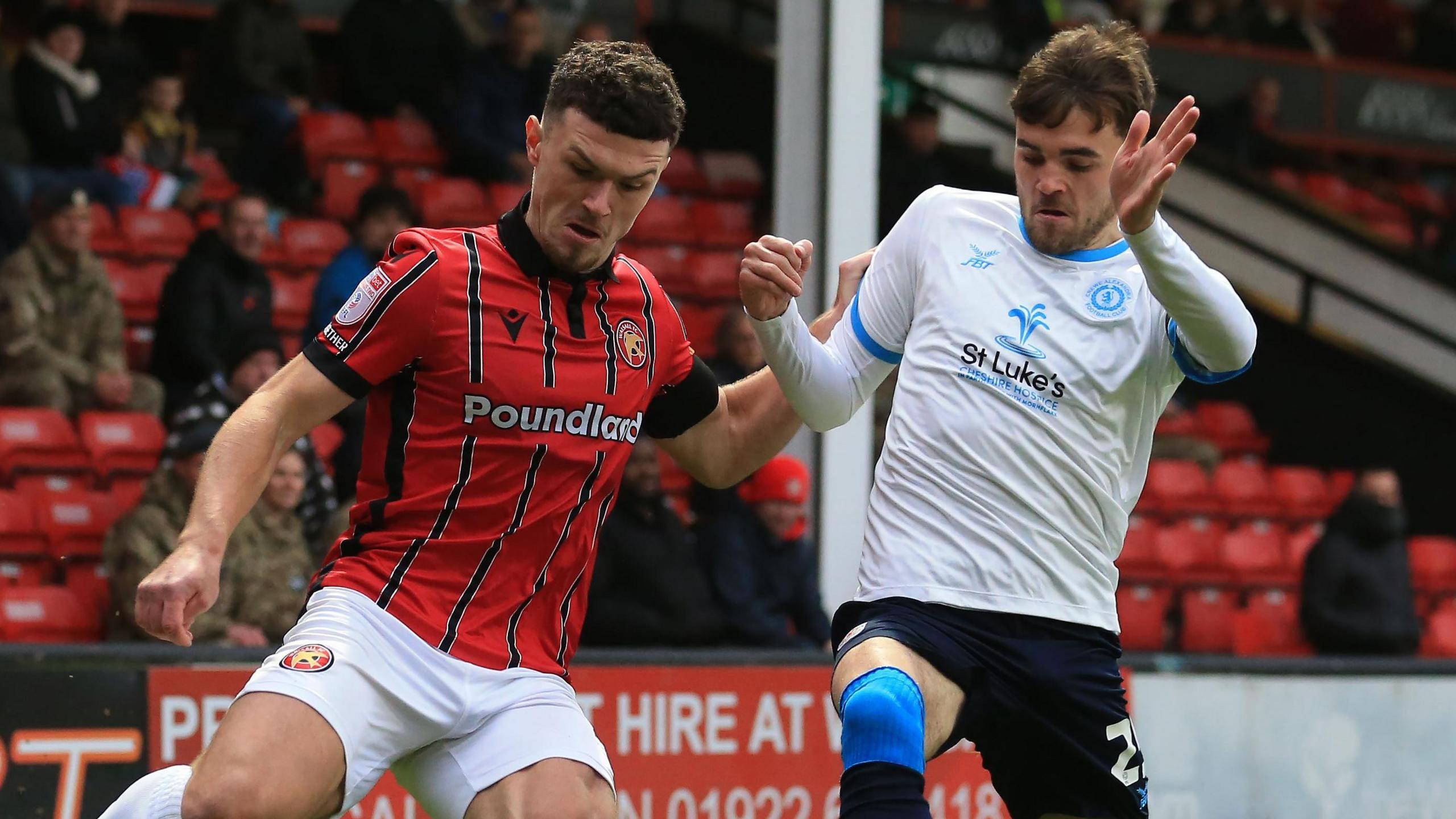 Max Conway of Crewe Alexandra closes down Walsall's Connor Barrett 