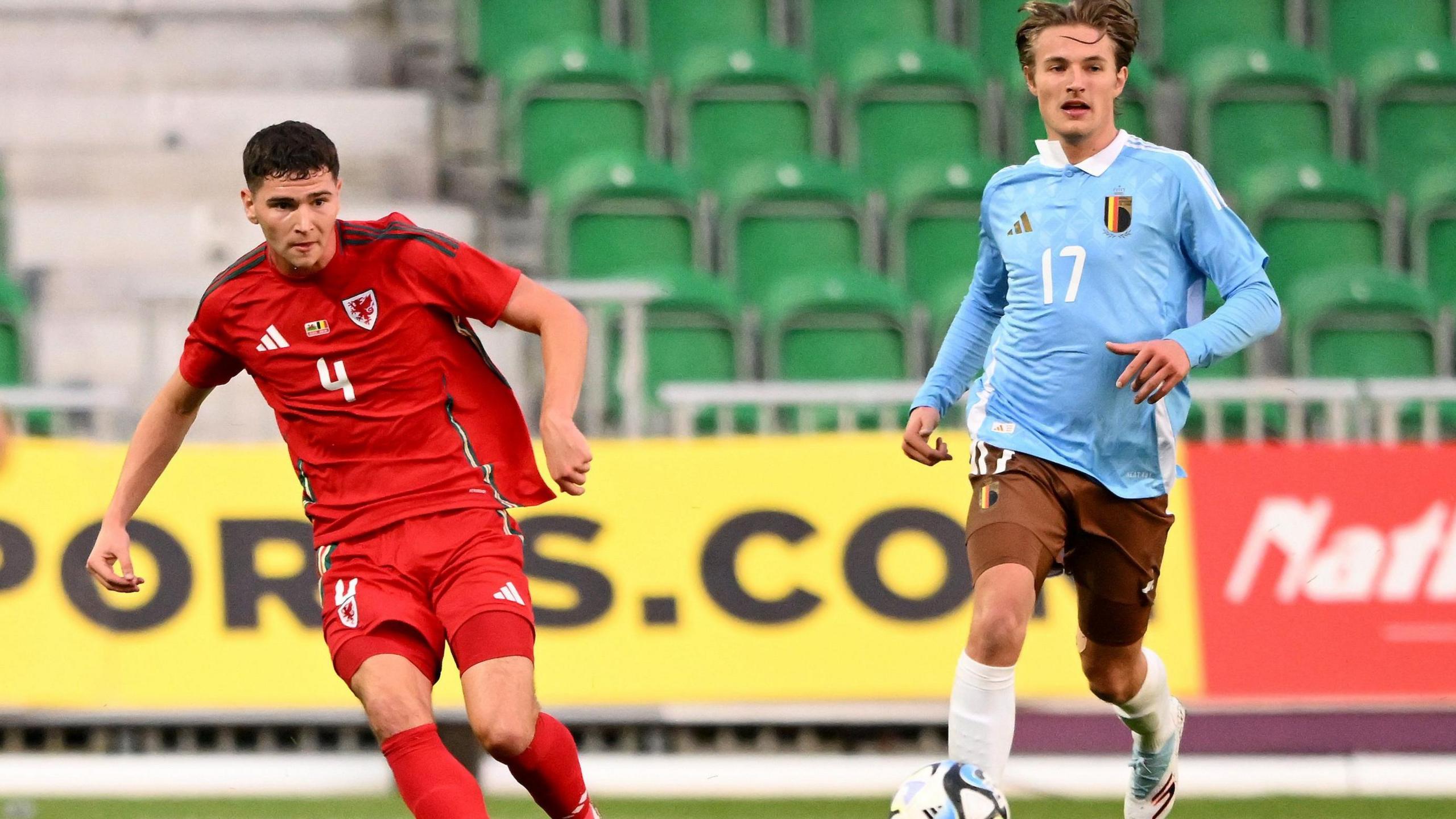 Wales' Ed James plays a ball out of defence against Belgium