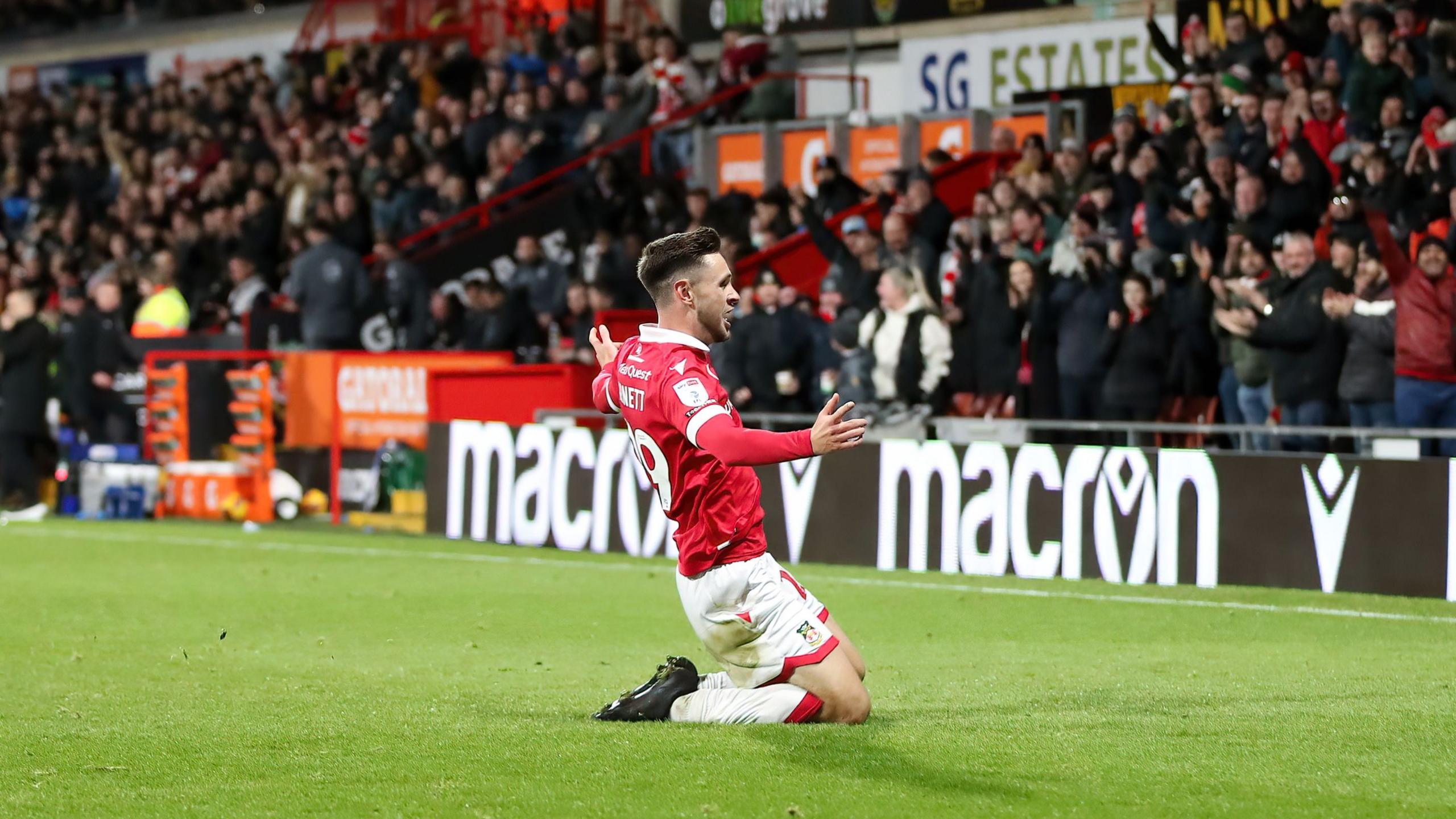 Wrexham wing-back Ryan Barnett celebrates scoring