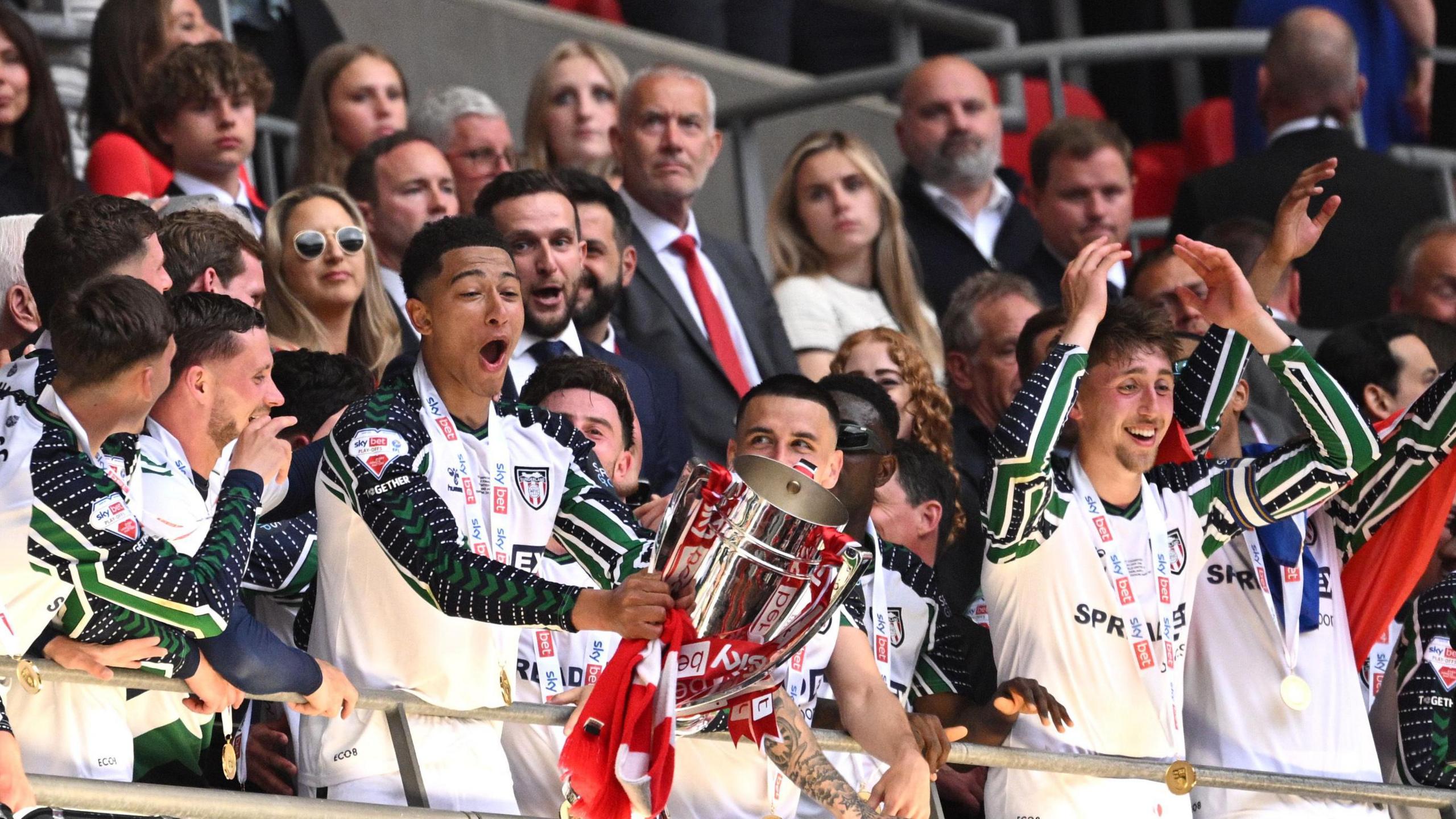 Sunderland's Jobe Bellingham lifting the Championship play-off trophy