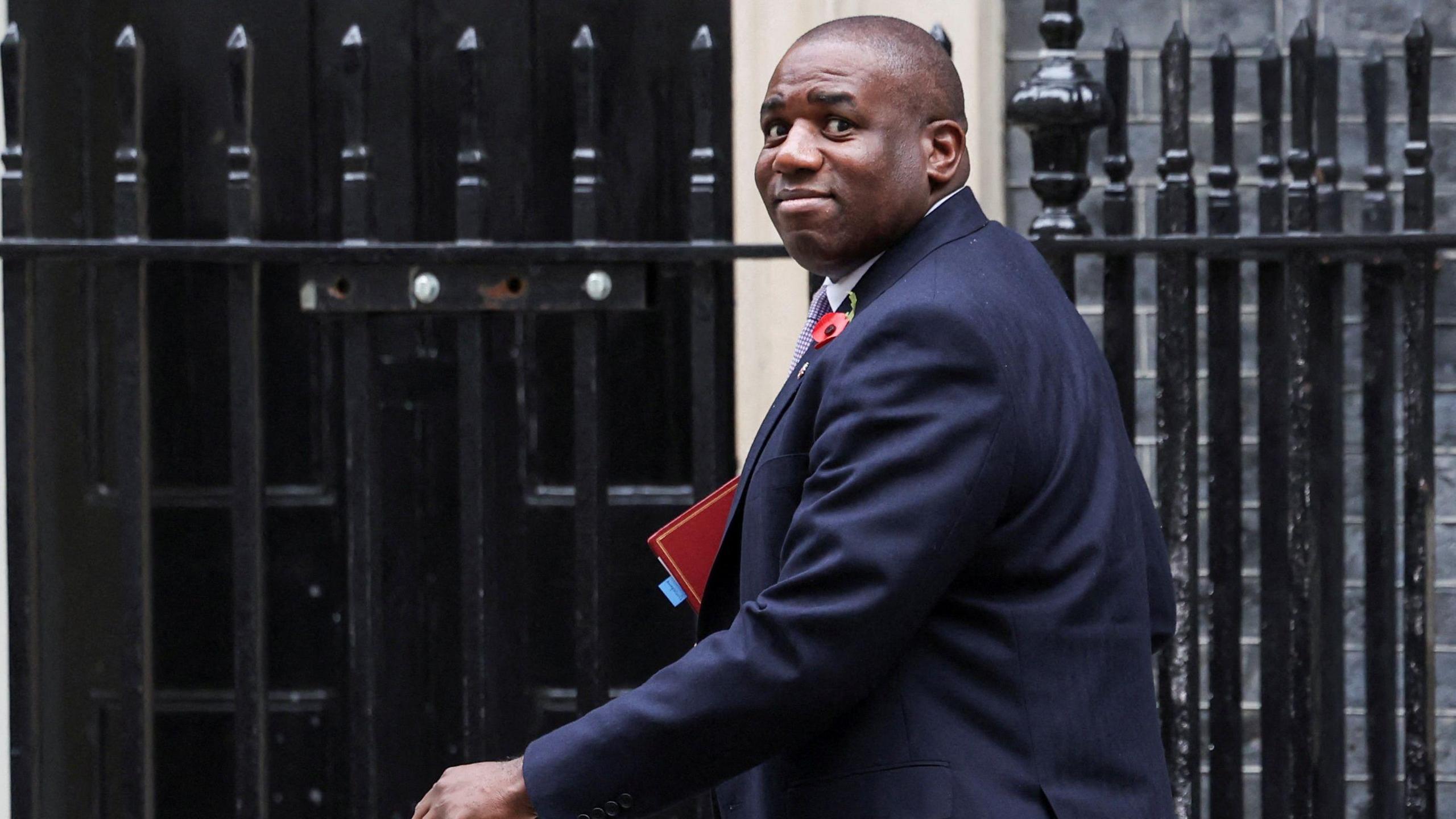 Foreign Secretary David Lammy has insisted that UK flights over Gaza have not shared intelligence with Israel. Lammy is seen walking into Number 10 Downing Street and is holding a binder.