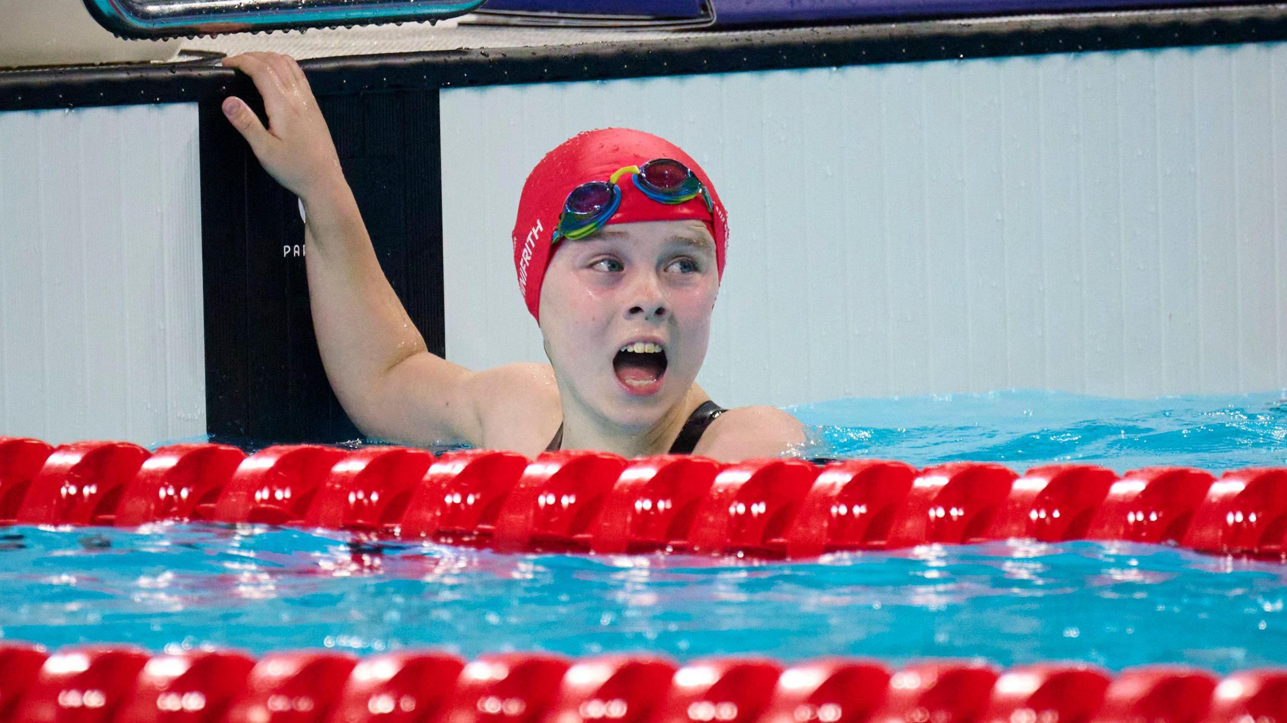 Iona Winnifrith looks up at the big screen after finishing fourth in the women's 200m individual medley