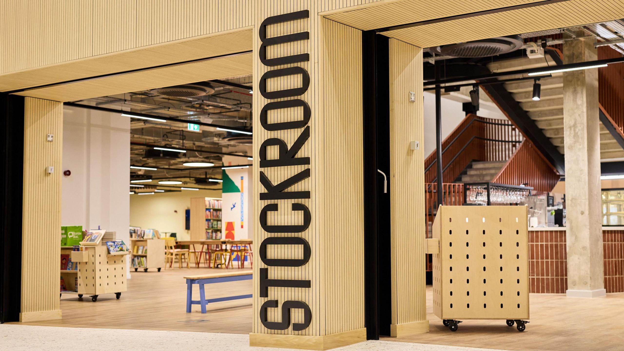 Stockroom has a wooden entrance with Stockroom written in black letters