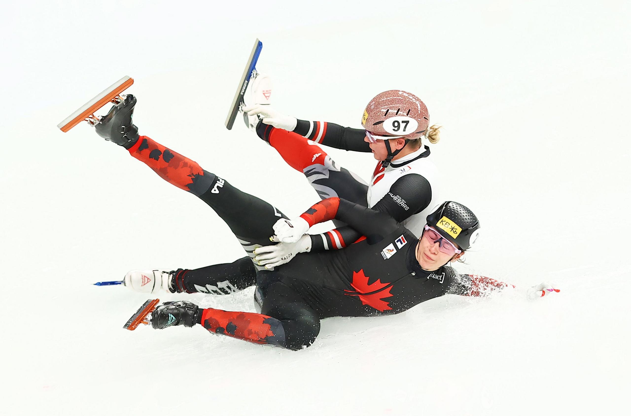 Rikki Doak of Canada and Natalia Maliszewska of Poland clash in the Women's 500m Heat during the ISU World Cup Short Track Speed Skating at Mokdong Ice rink